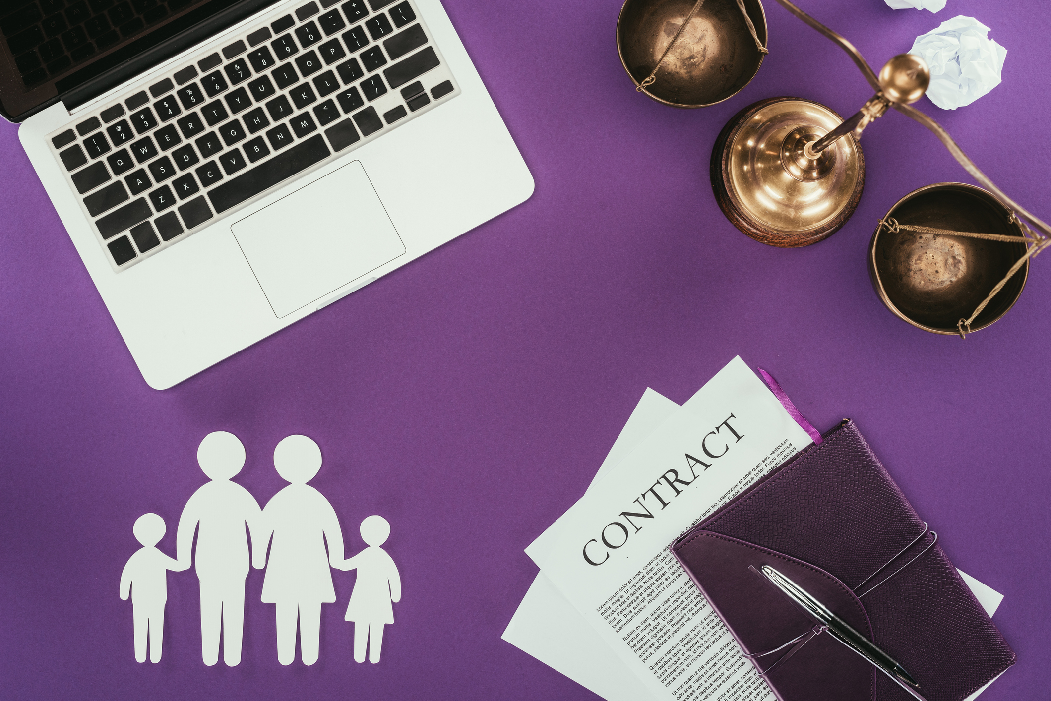 top view of business workplace with family insurance concept on purple surface