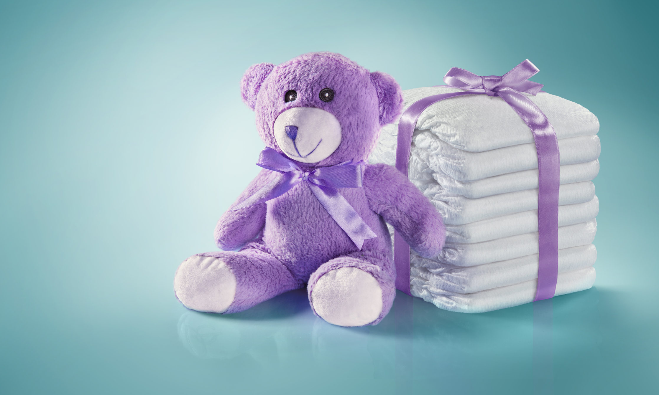 Baby concept. Diapers and Teddy bear. Isolated present