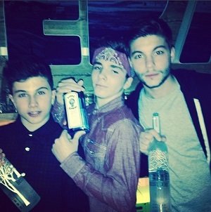 Madonna's son Rocco holding booze