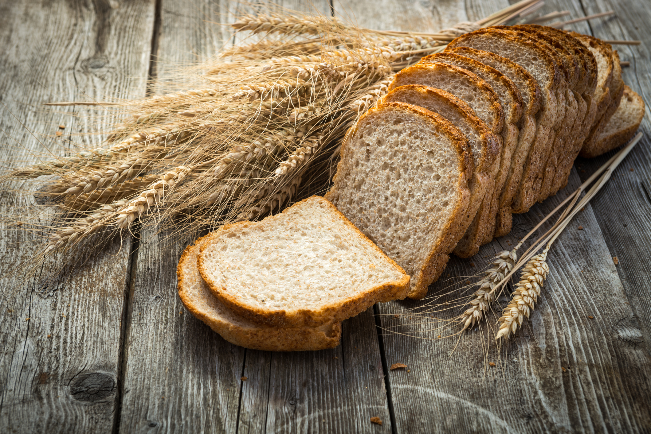 fresh bread  and wheat on the wooden