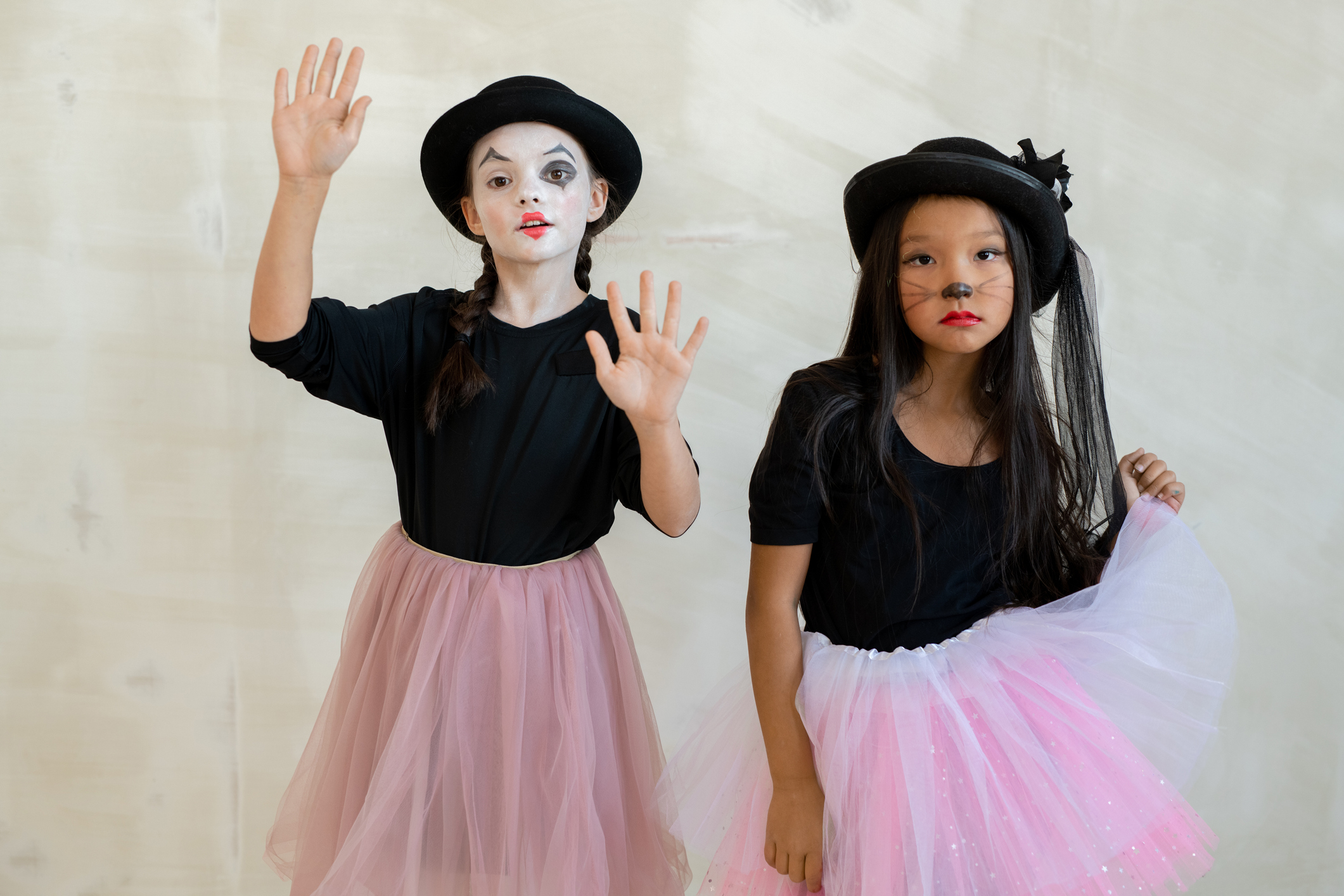 Two cute girls with halloween makeup doing pantomime