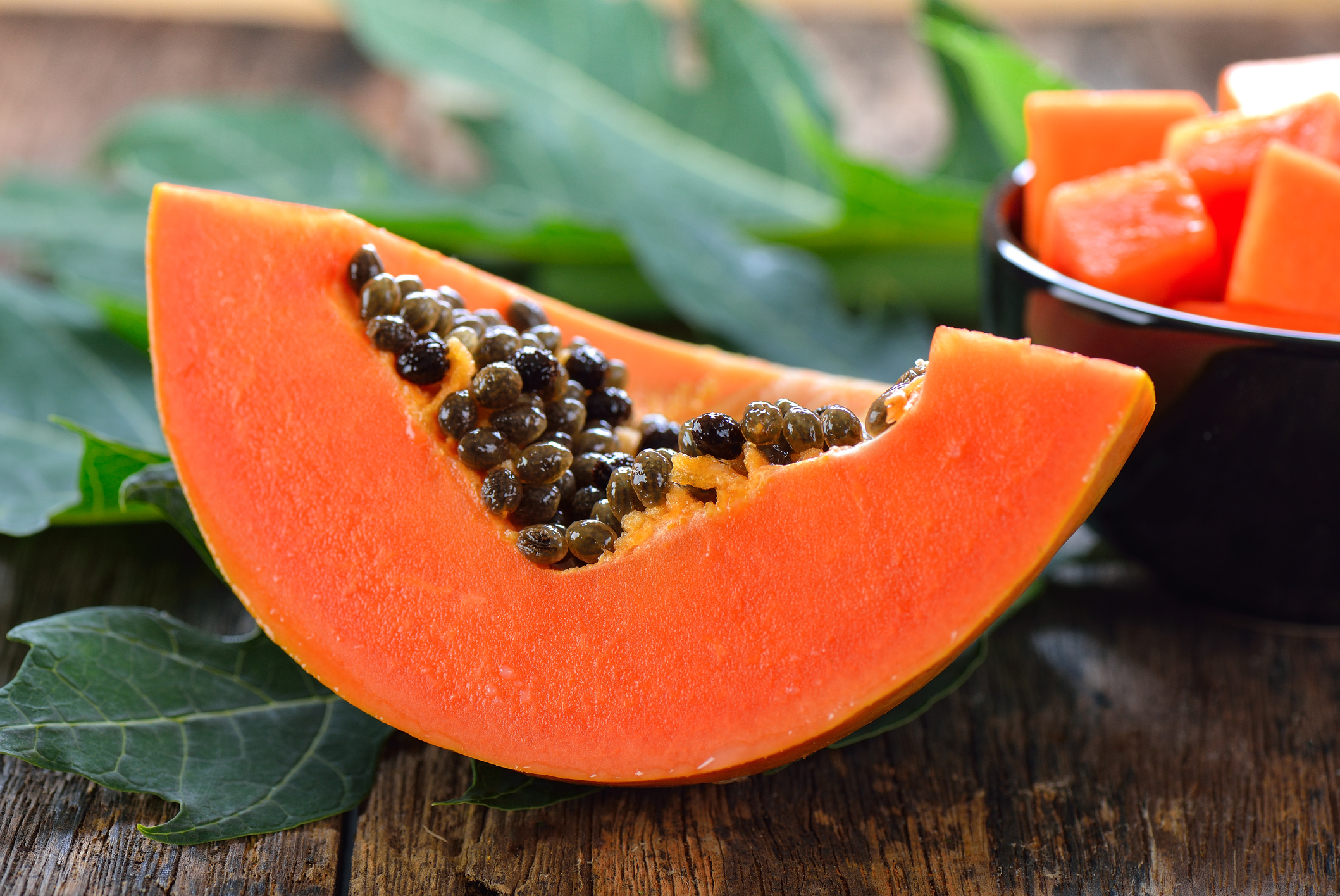 papaya slice on wood