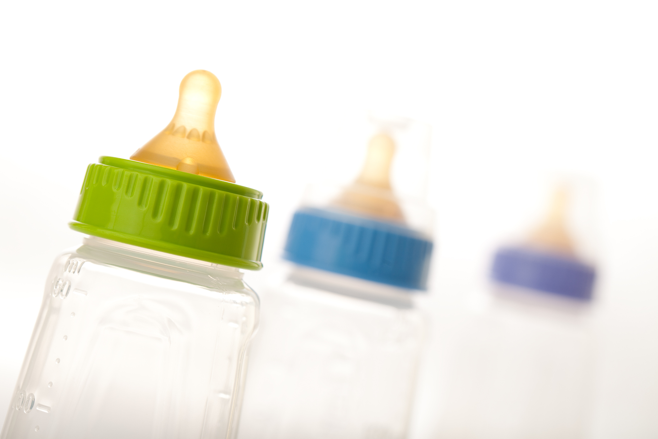 Three empty Baby Bottles on white