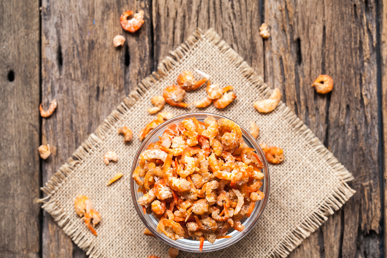 Dried shrimp in bowl on sackcloth