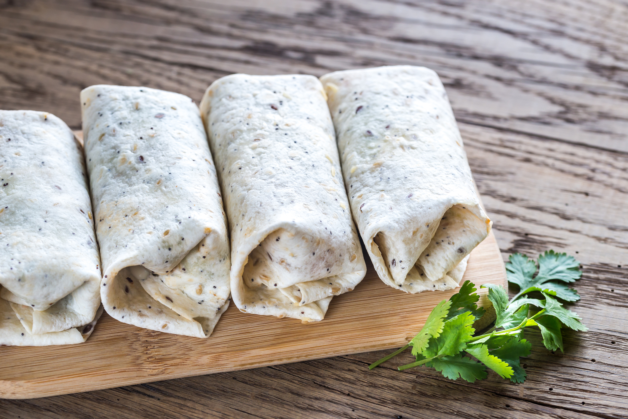 Chicken burritos on the wooden background