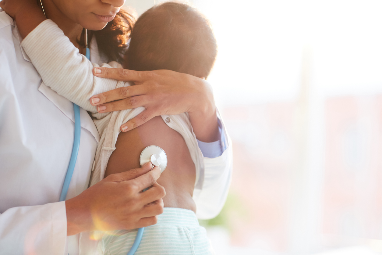 Nurse examining the child