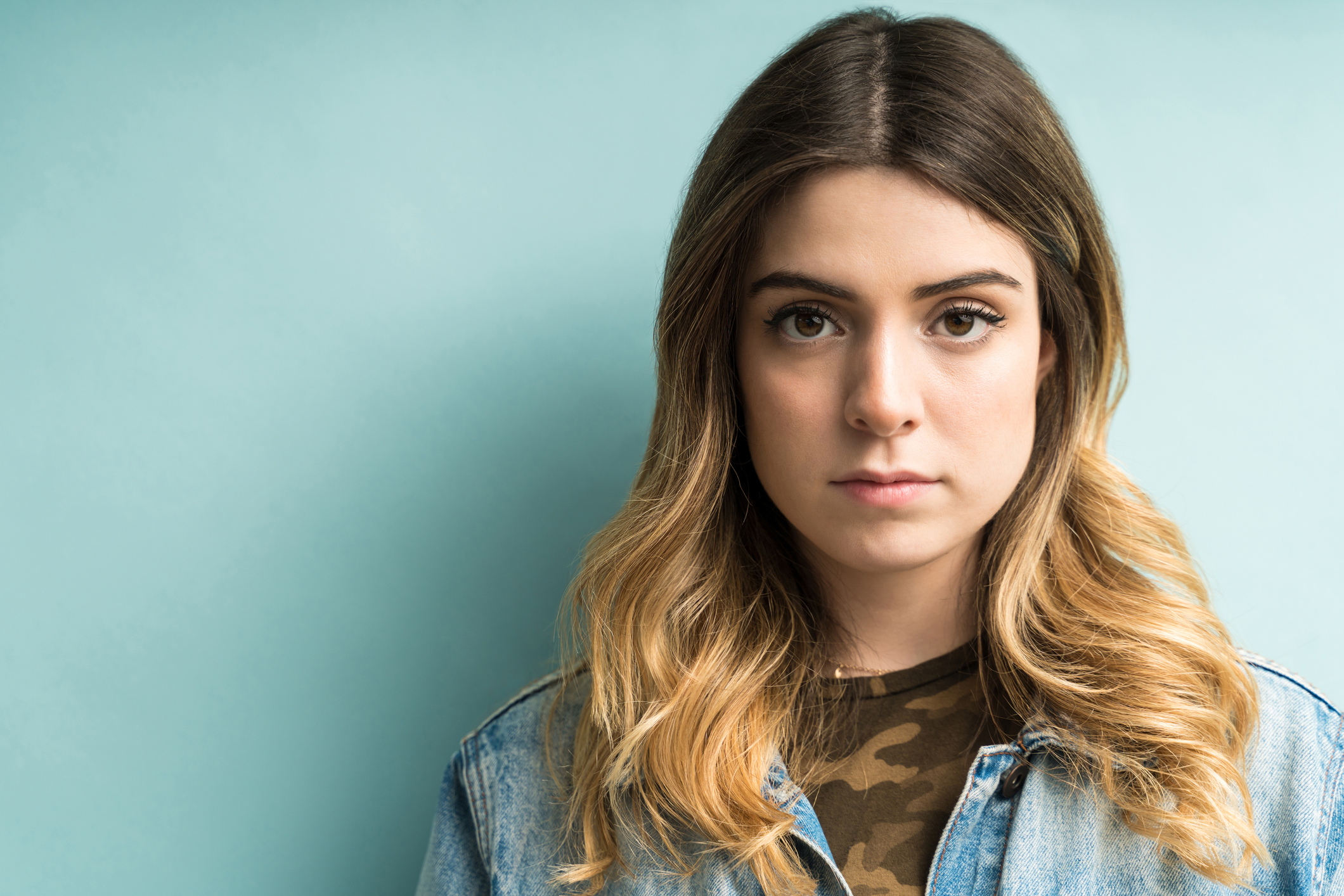 Pretty Female Making Eye Contact In Studio