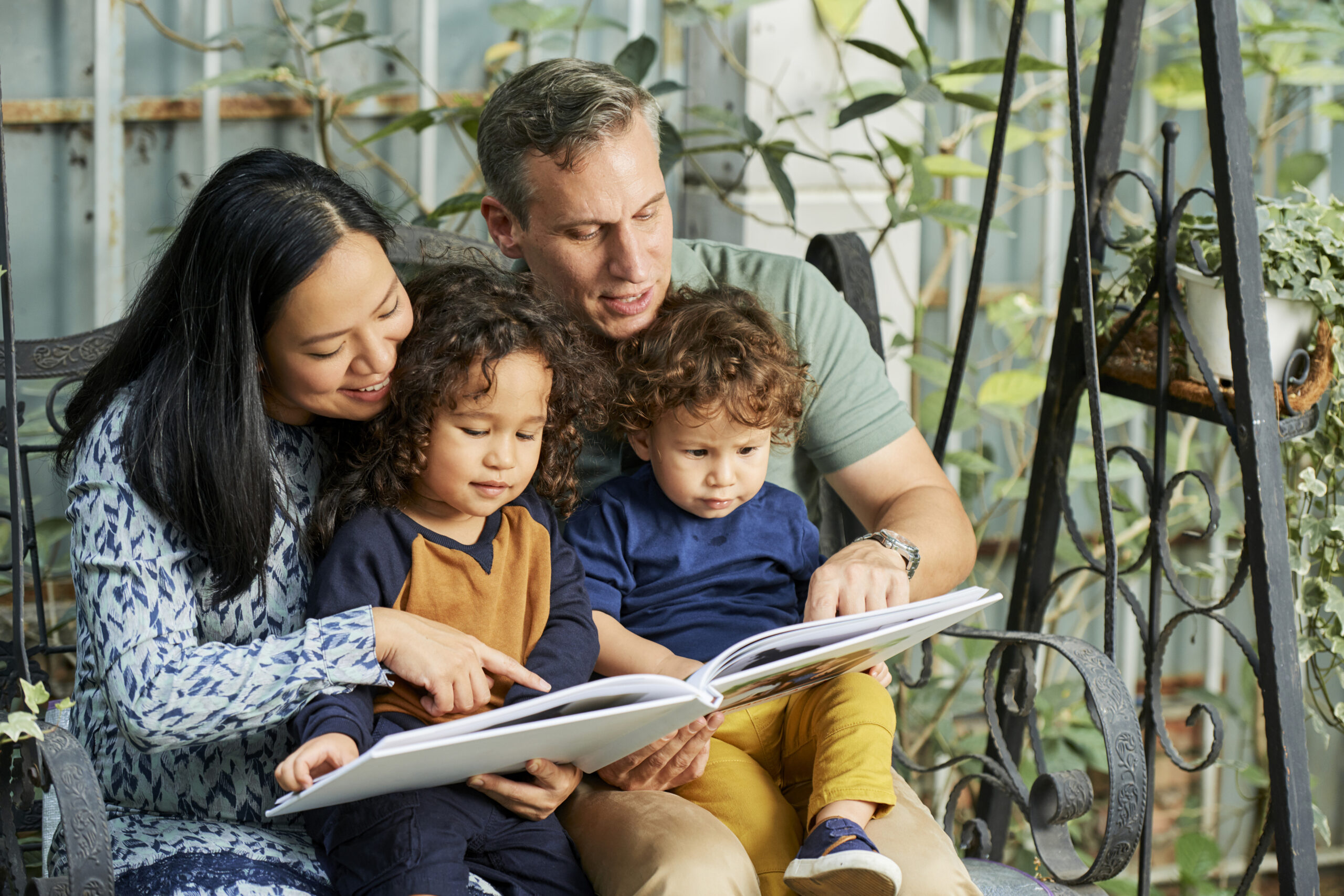 Family reading a book together