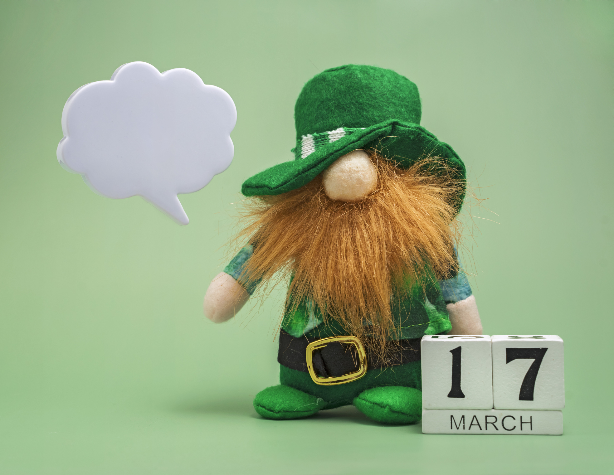 st patrick's day background with red-bearded leprechaun in green top hat