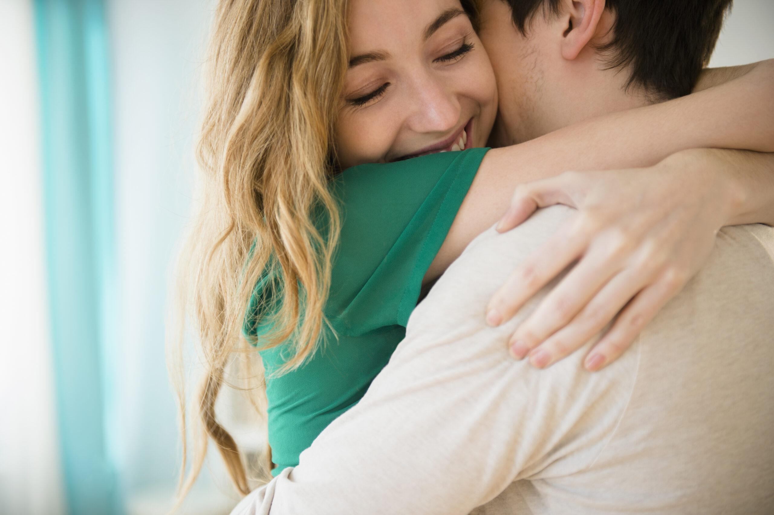 Woman hugging boyfriend