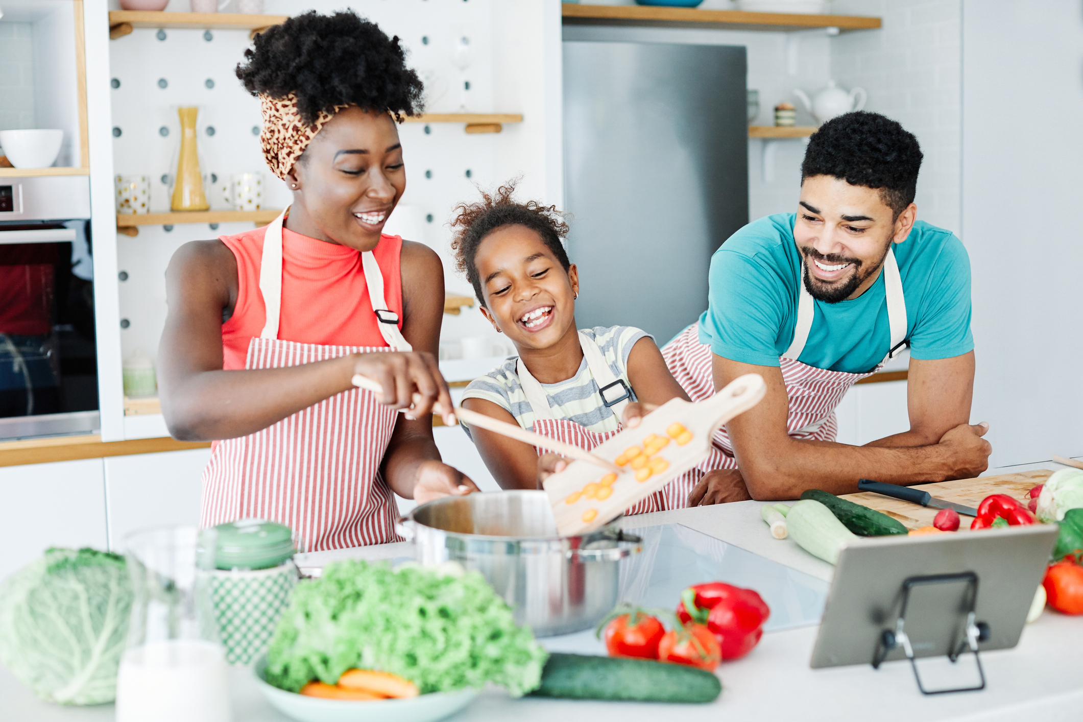 family child kitchen food daughter mother father cooking preparing breakfast  happy together