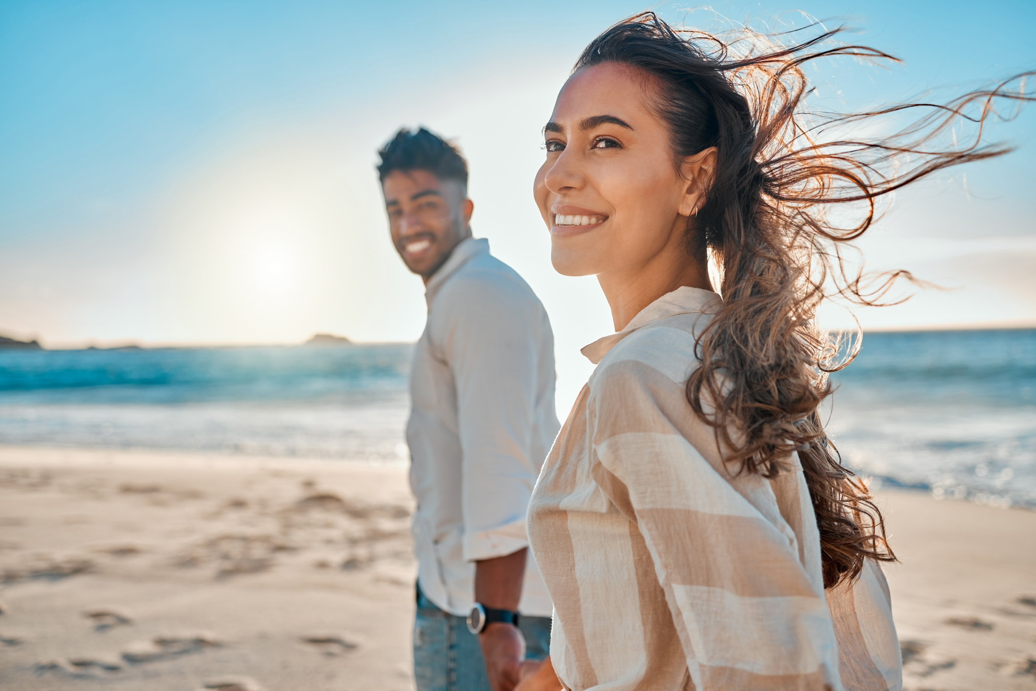 Shot of a young couple spending time together at the beach