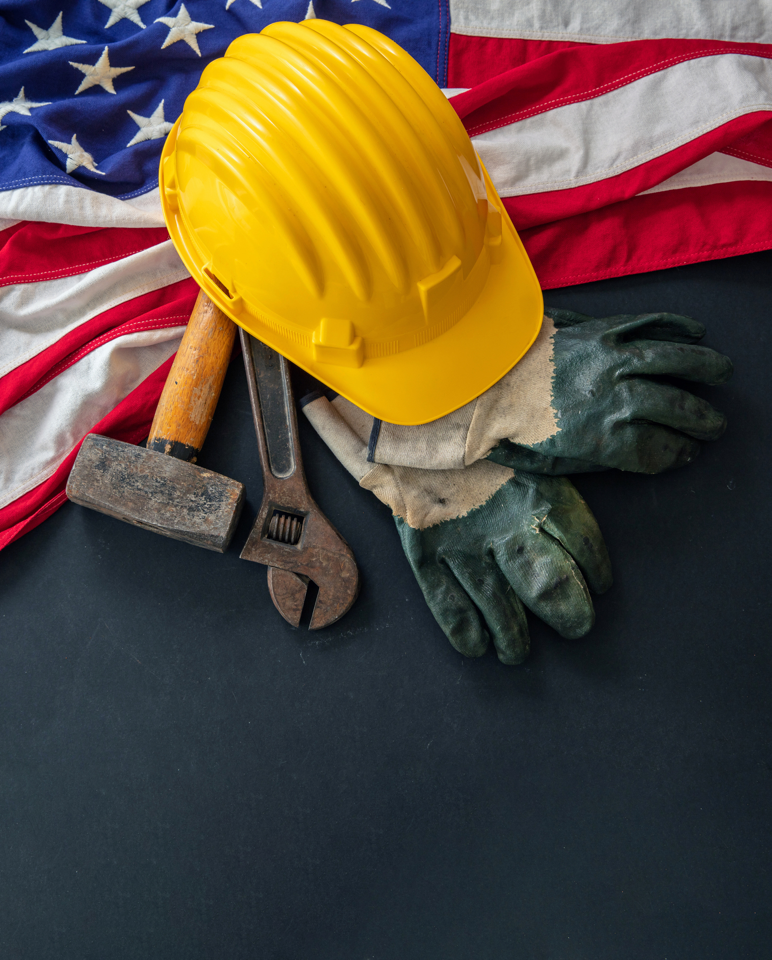 Labor Day. American flag and construction tool, above view. USA Holiday celebration