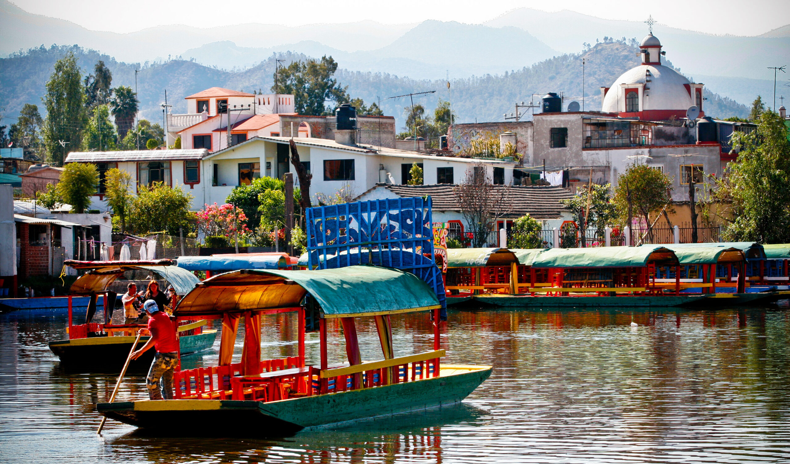 Some characteristic and colorful Trajineras boats in Lake Xochimilco south of Mexico City