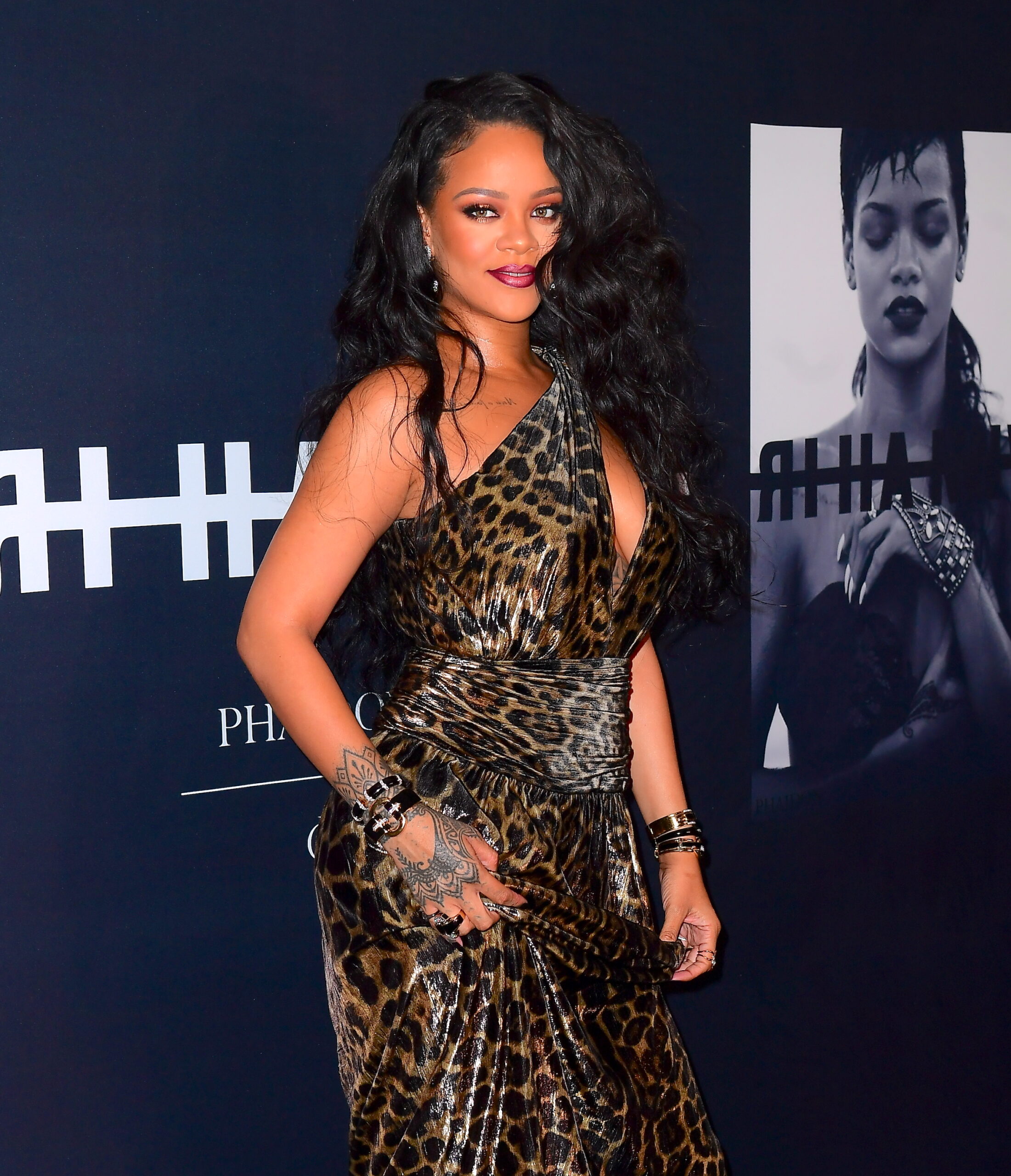 Rihanna Sizzles In Leopard Print Dress At Her Rihanna Book Launch Party In NYC