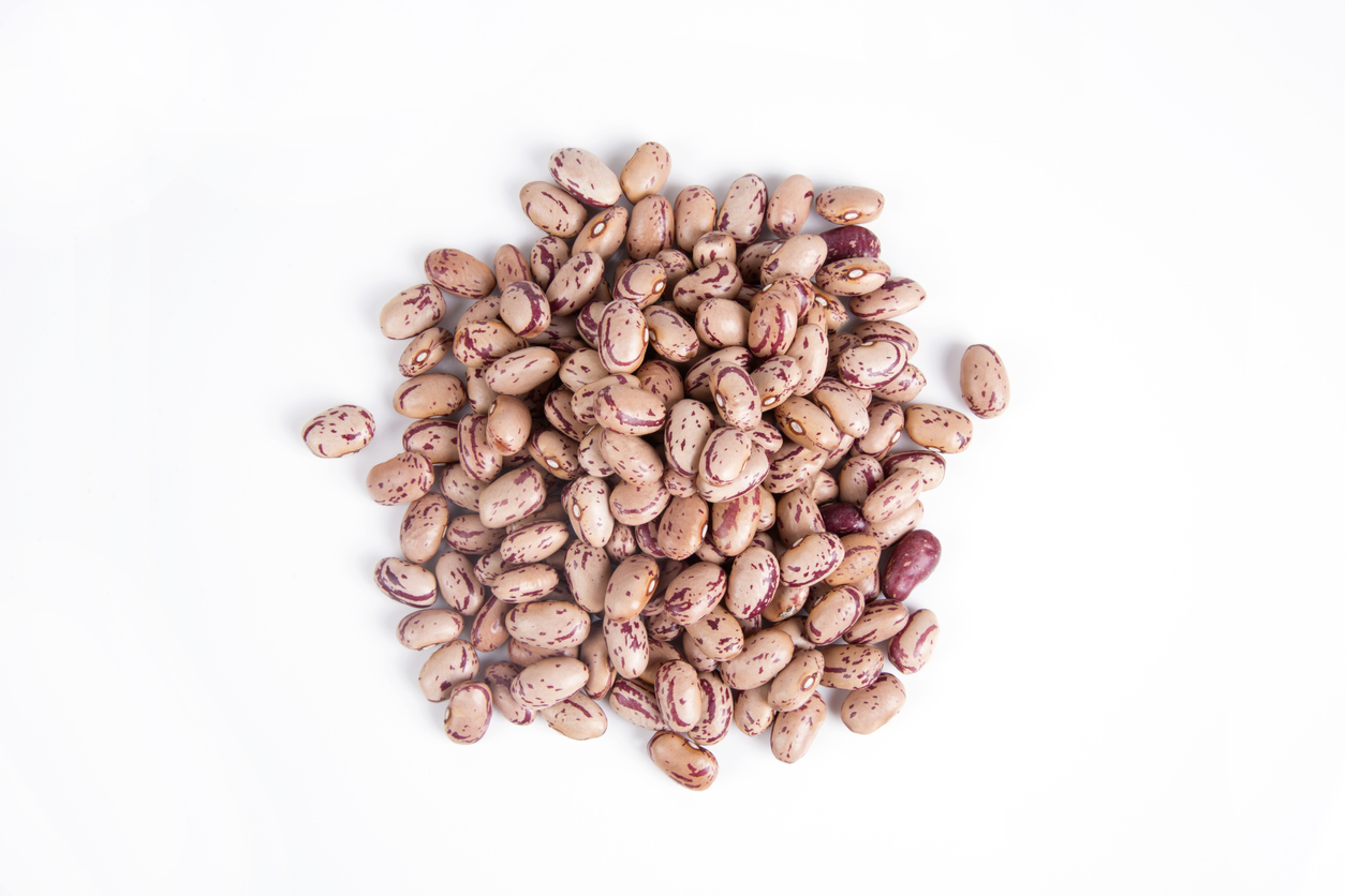 Dry pinto beans isolated on white background