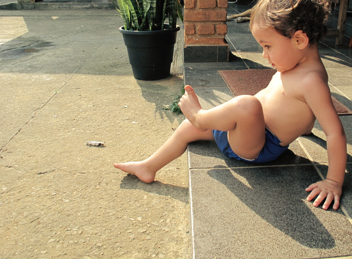 Toddler playing in the yard