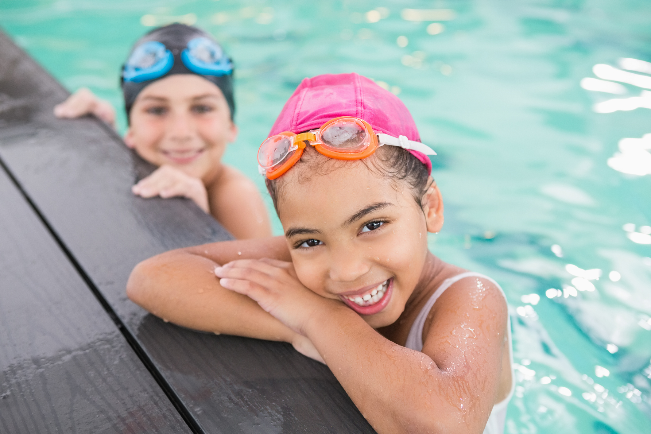 Cute swimming class in the pool