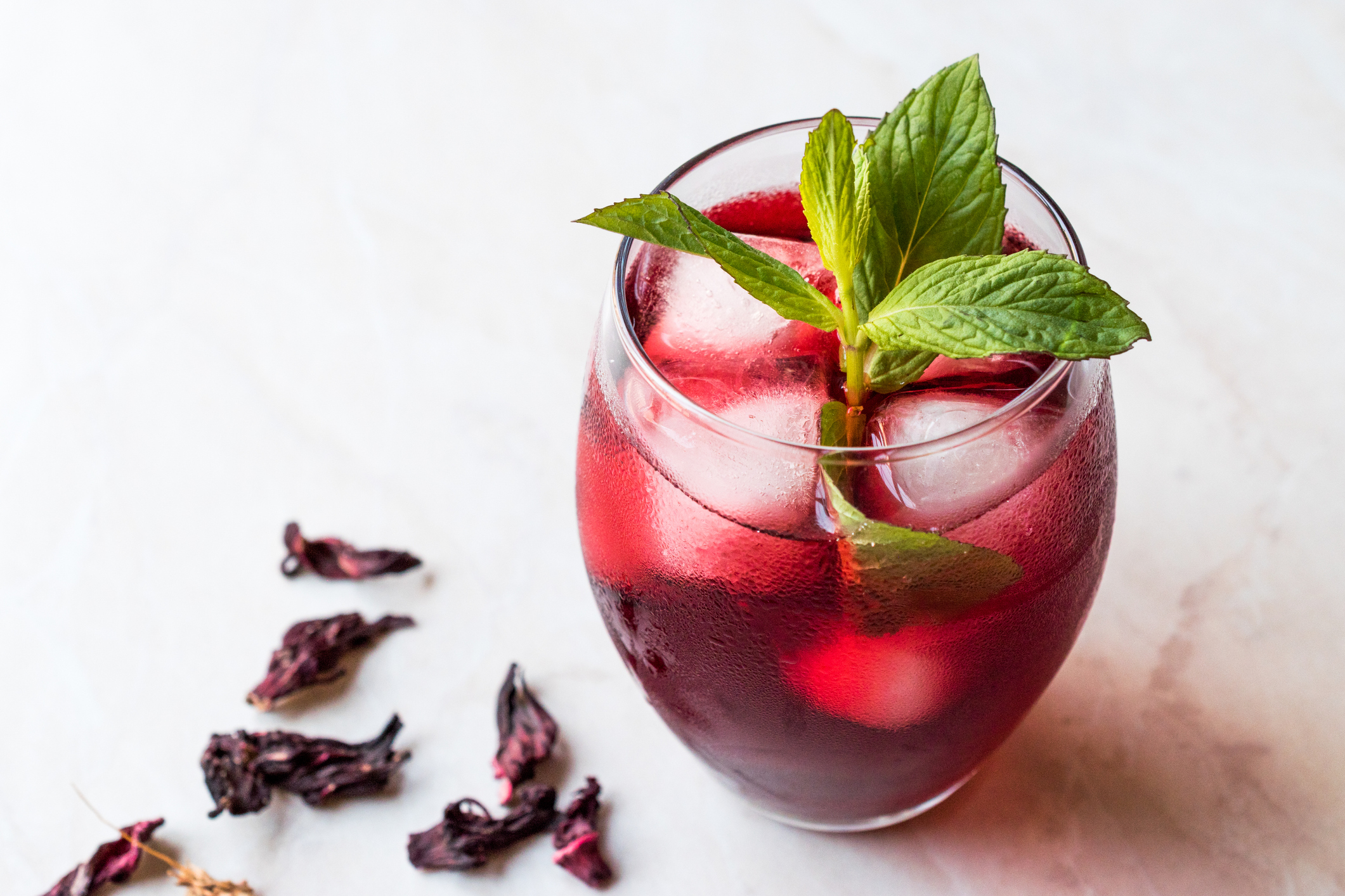 Cold Brew Hibiscus Tea with ice and Mint Leaves.