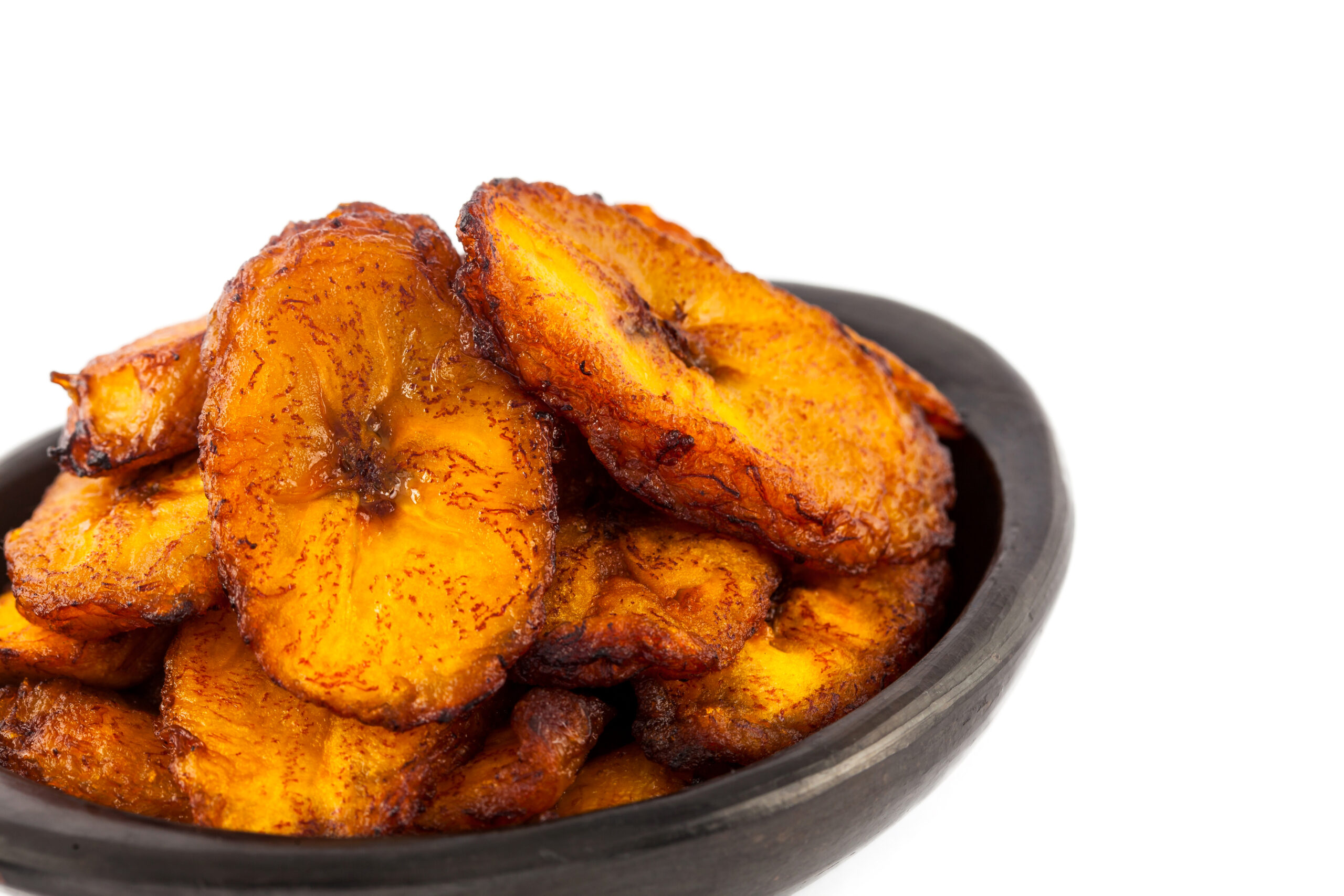 Deep fried ripe plantain slices isolated in white background