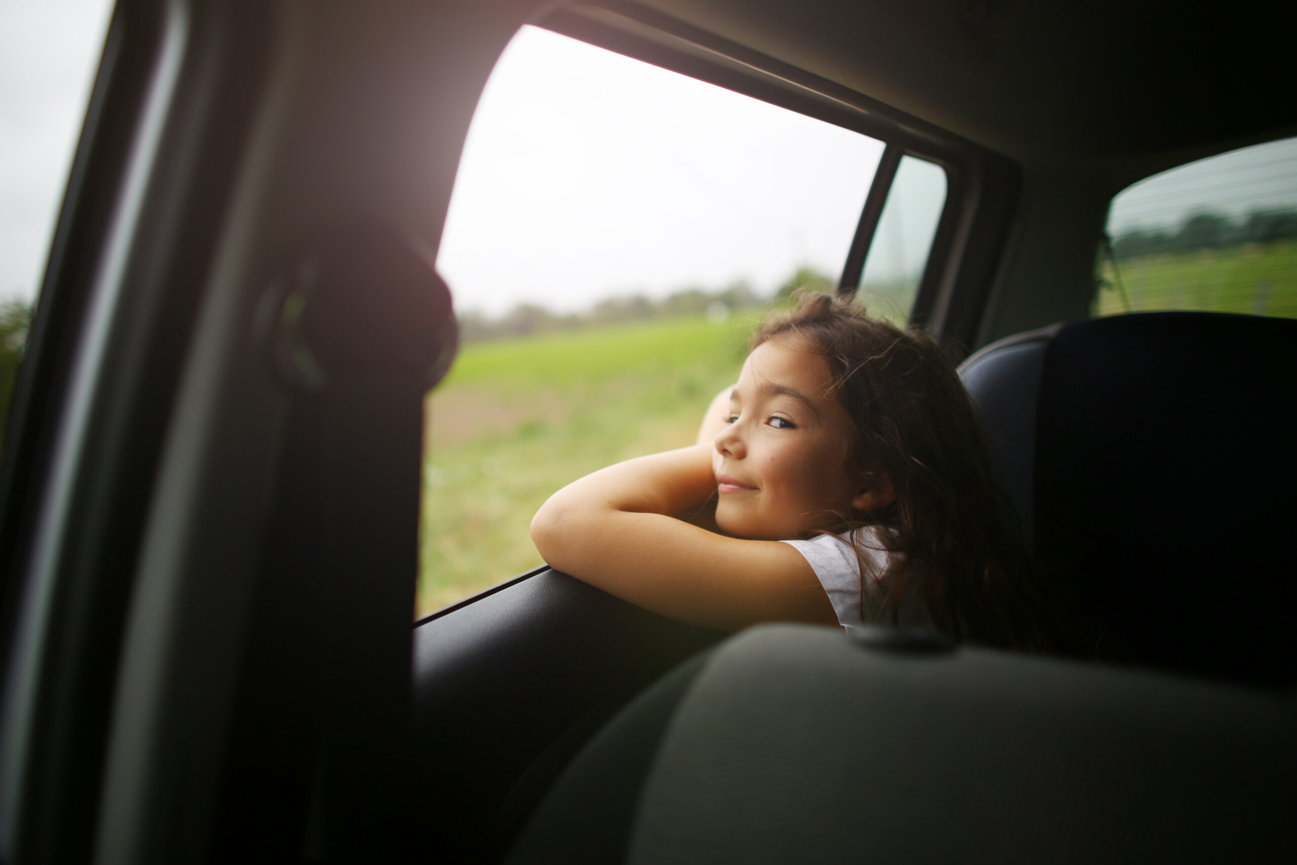 Child looking out car window