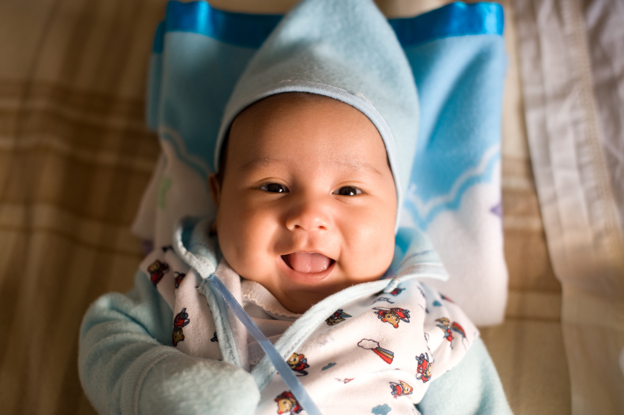 Hispanic male baby smiling