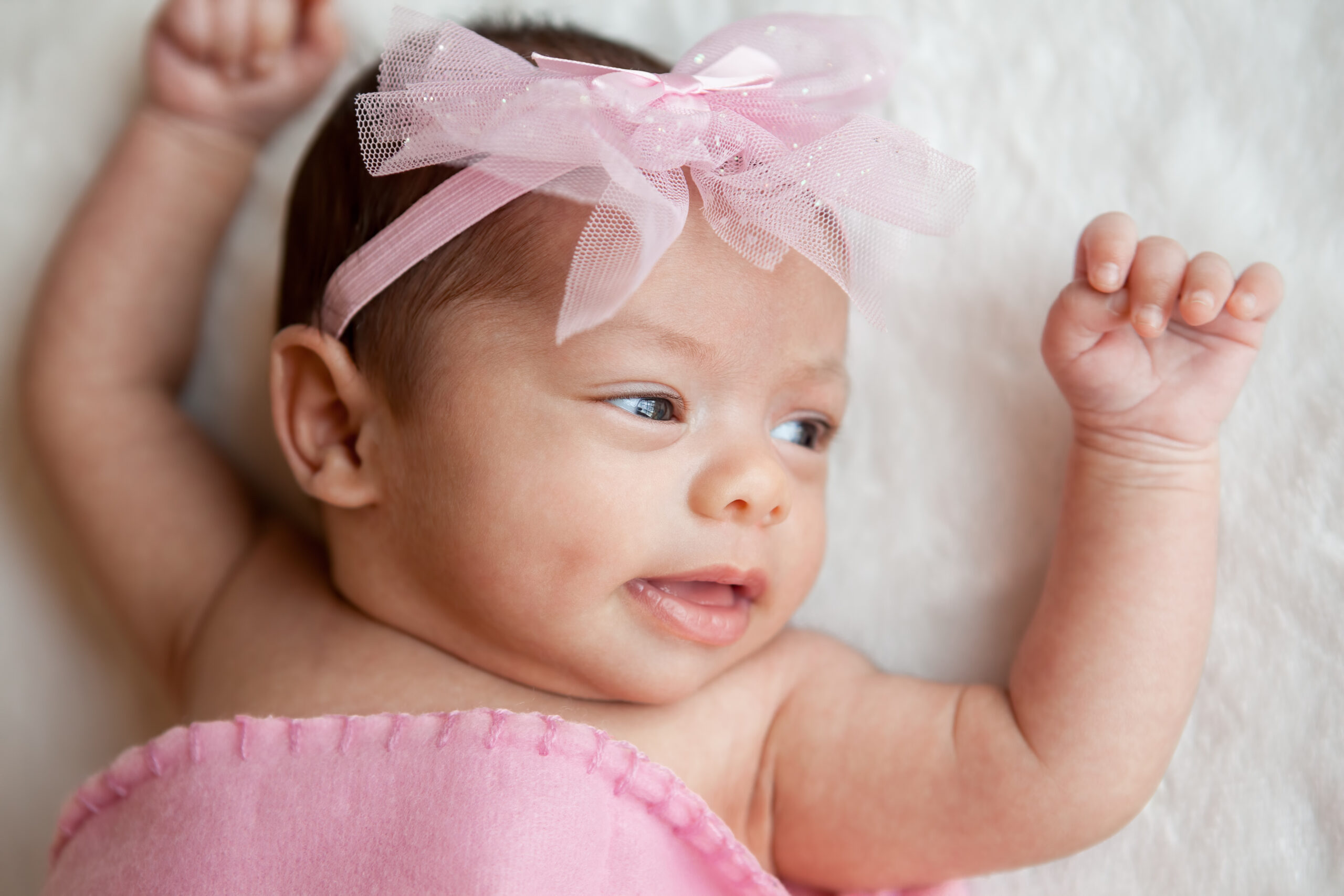 Happy newborn baby girl portrait