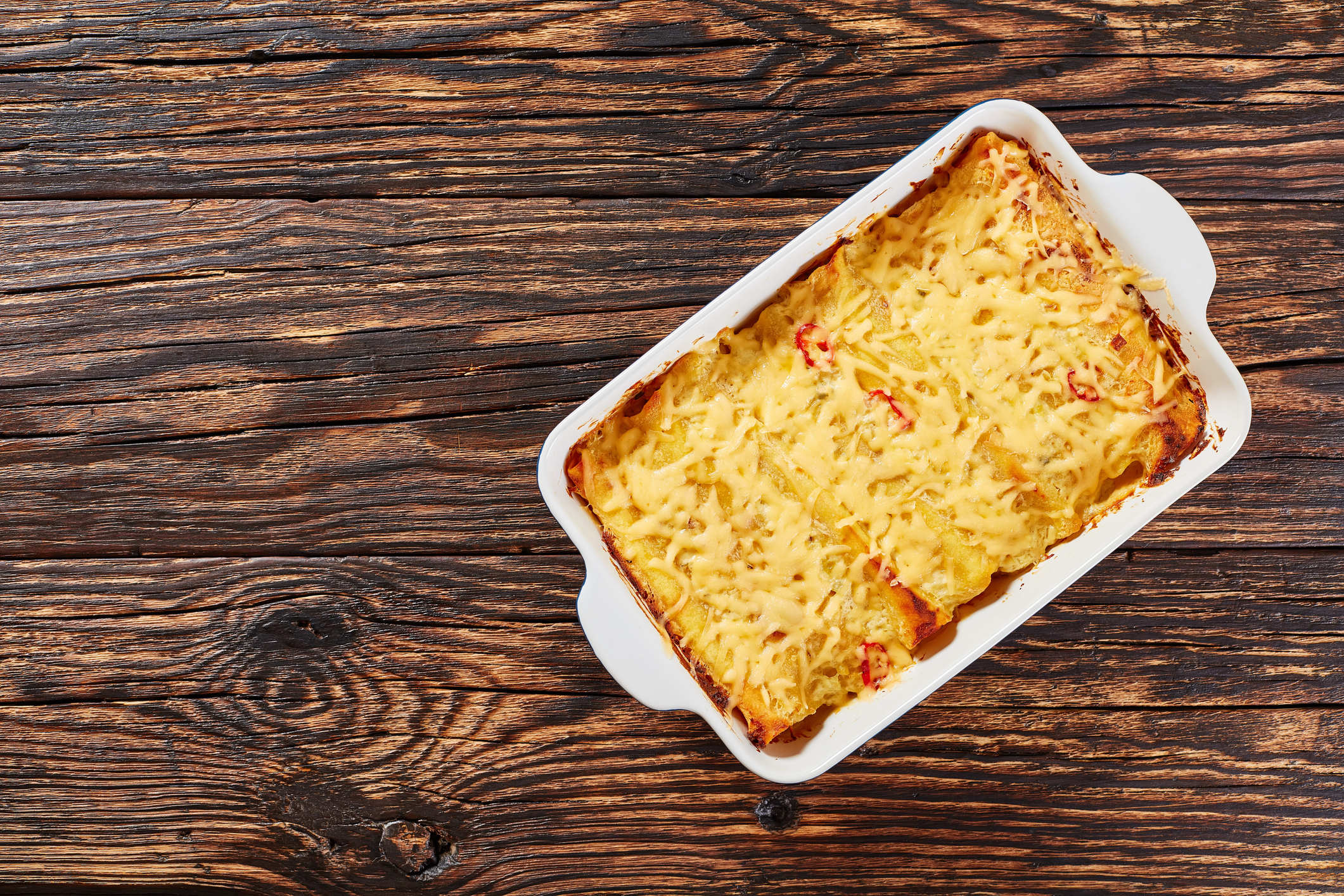 hot homemade enchiladas in baking dish