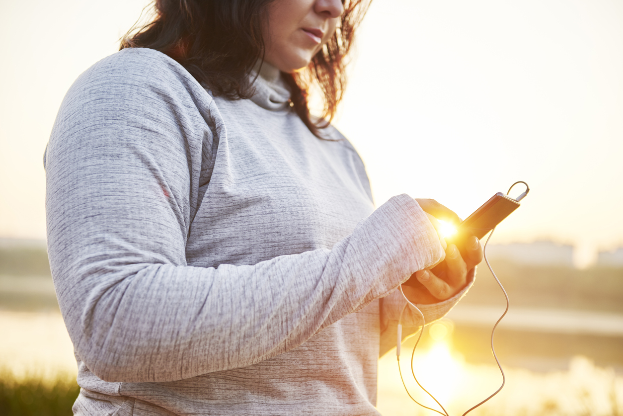 Female athlete using a mobile phone during a short break