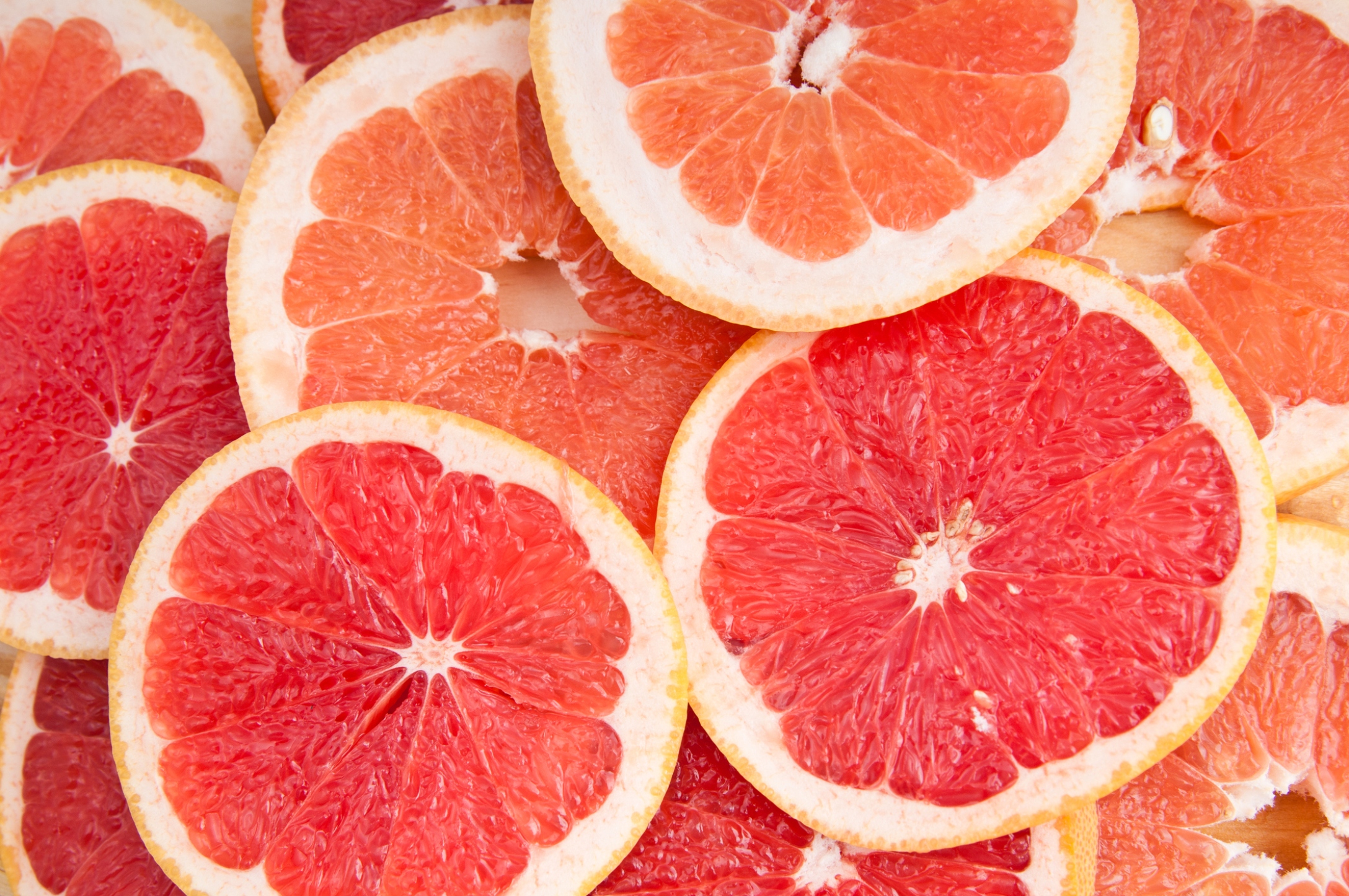 fresh grapefruit and slices background