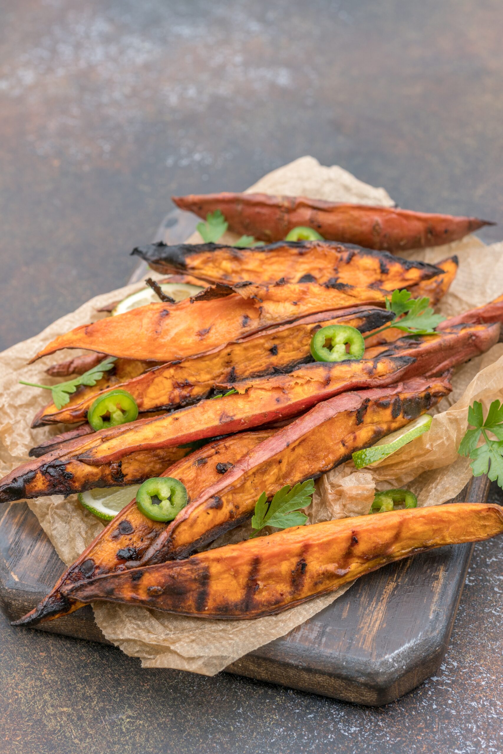 Roasted sweet potatoes on the grill with herbs