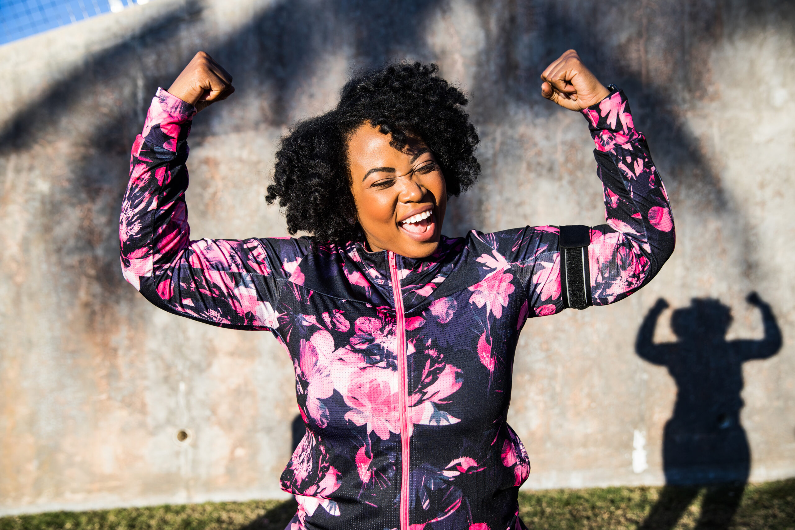 Funny portrait of a young black curvy woman during a training session