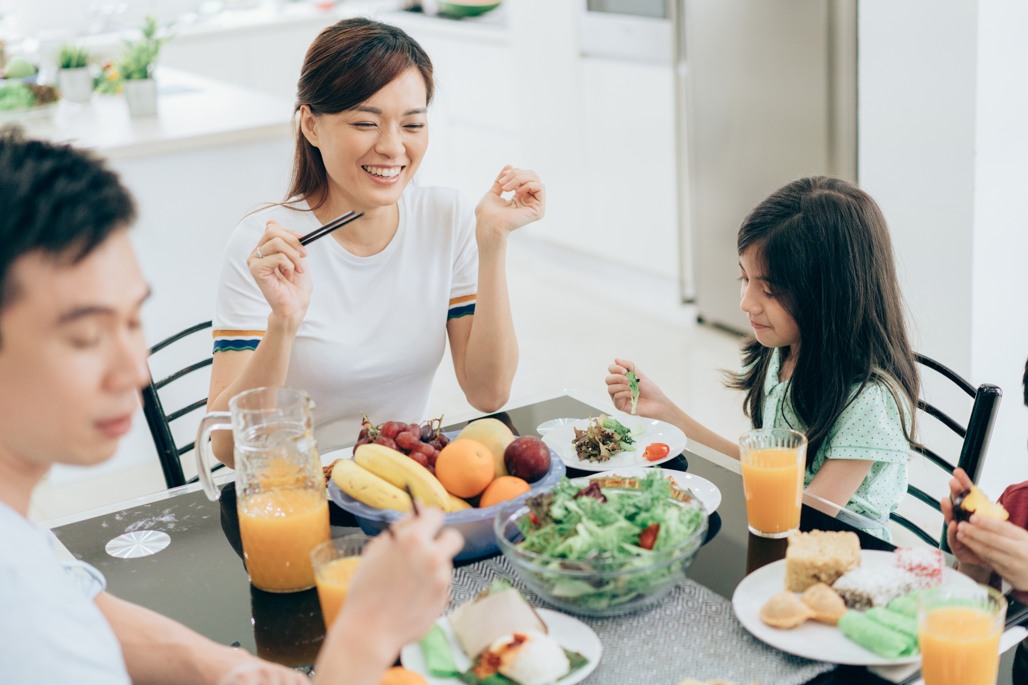 Happy family having a breakfast together