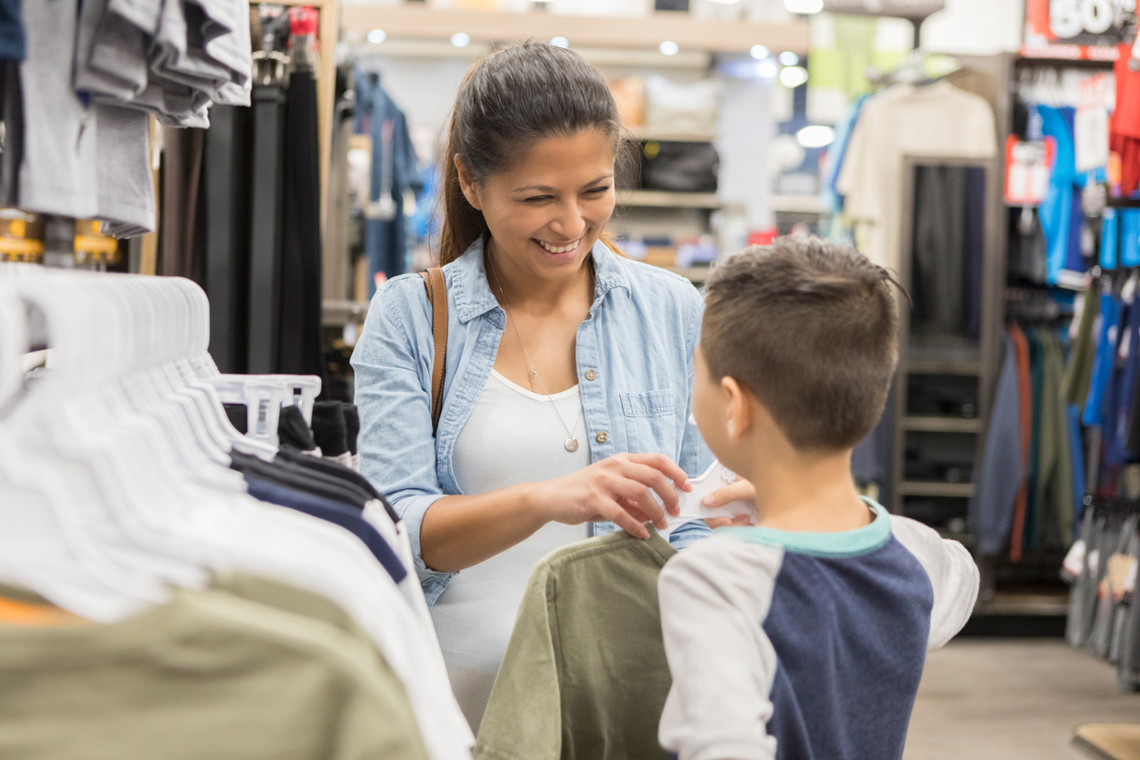 Mom shops for clothes for her son