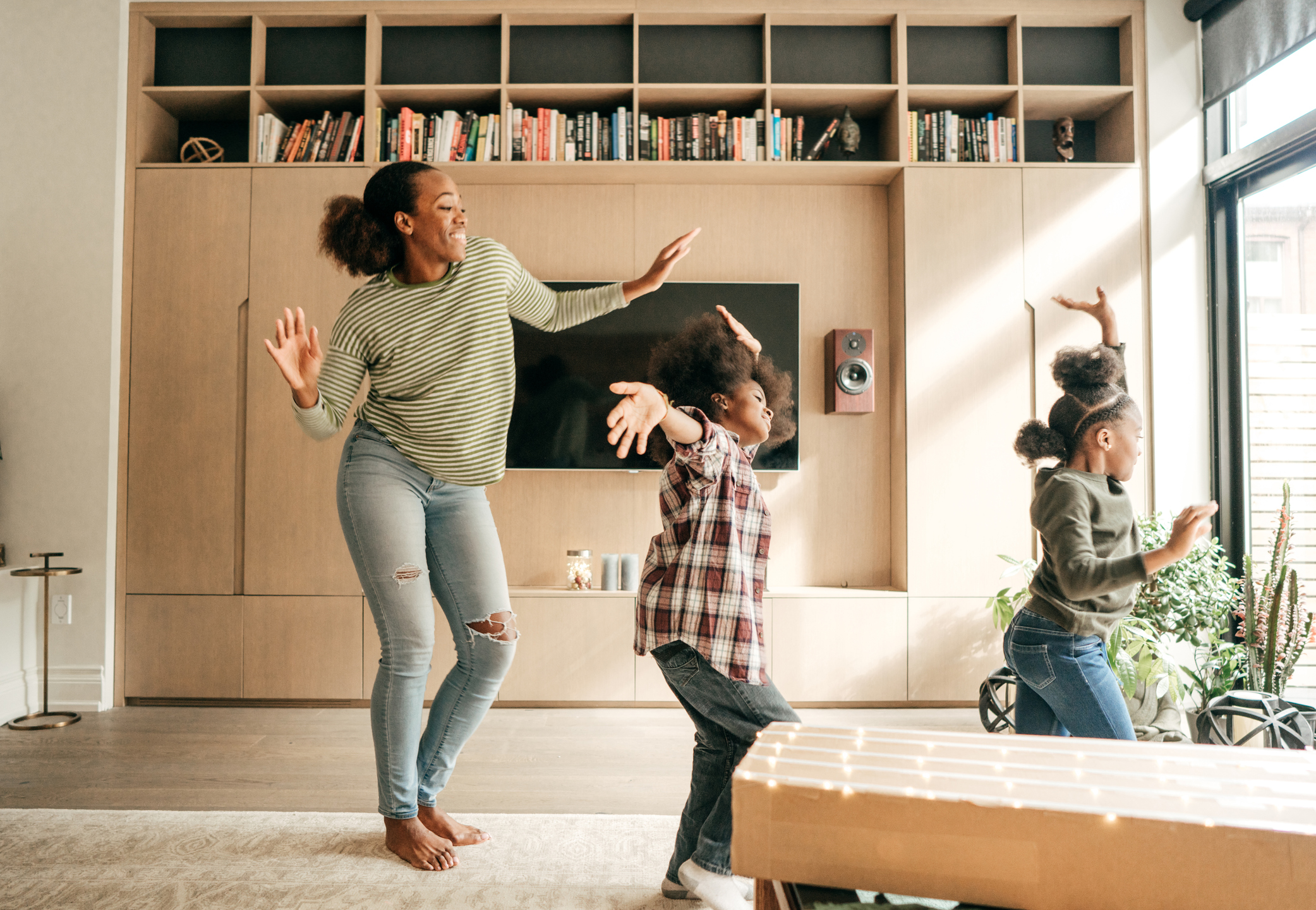 Mother and kids dancing