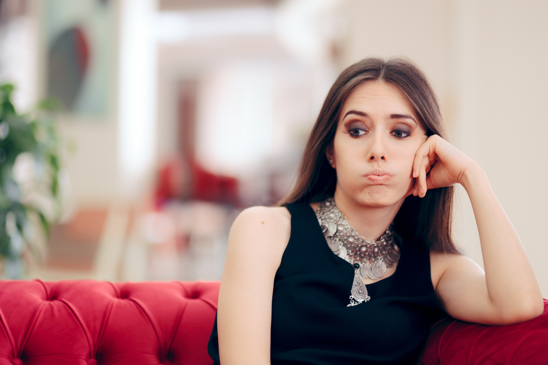 Funny Bored Elegant Woman Waiting in Hotel Lobby