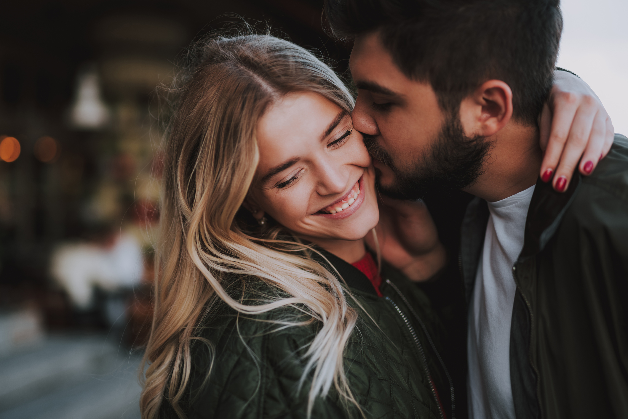 Beautiful young couple expressing their feelings on the street