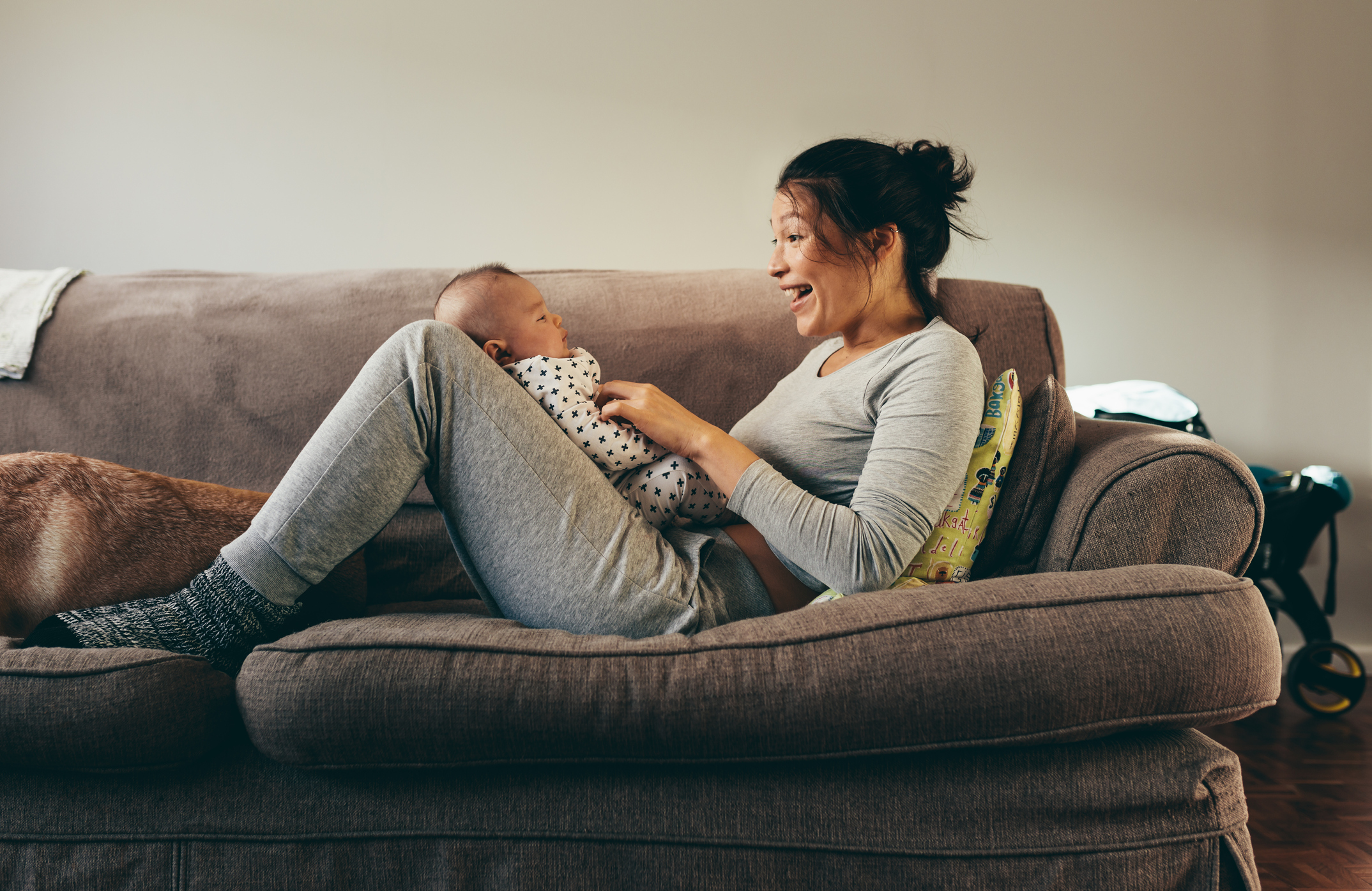 Young mother playing with her baby