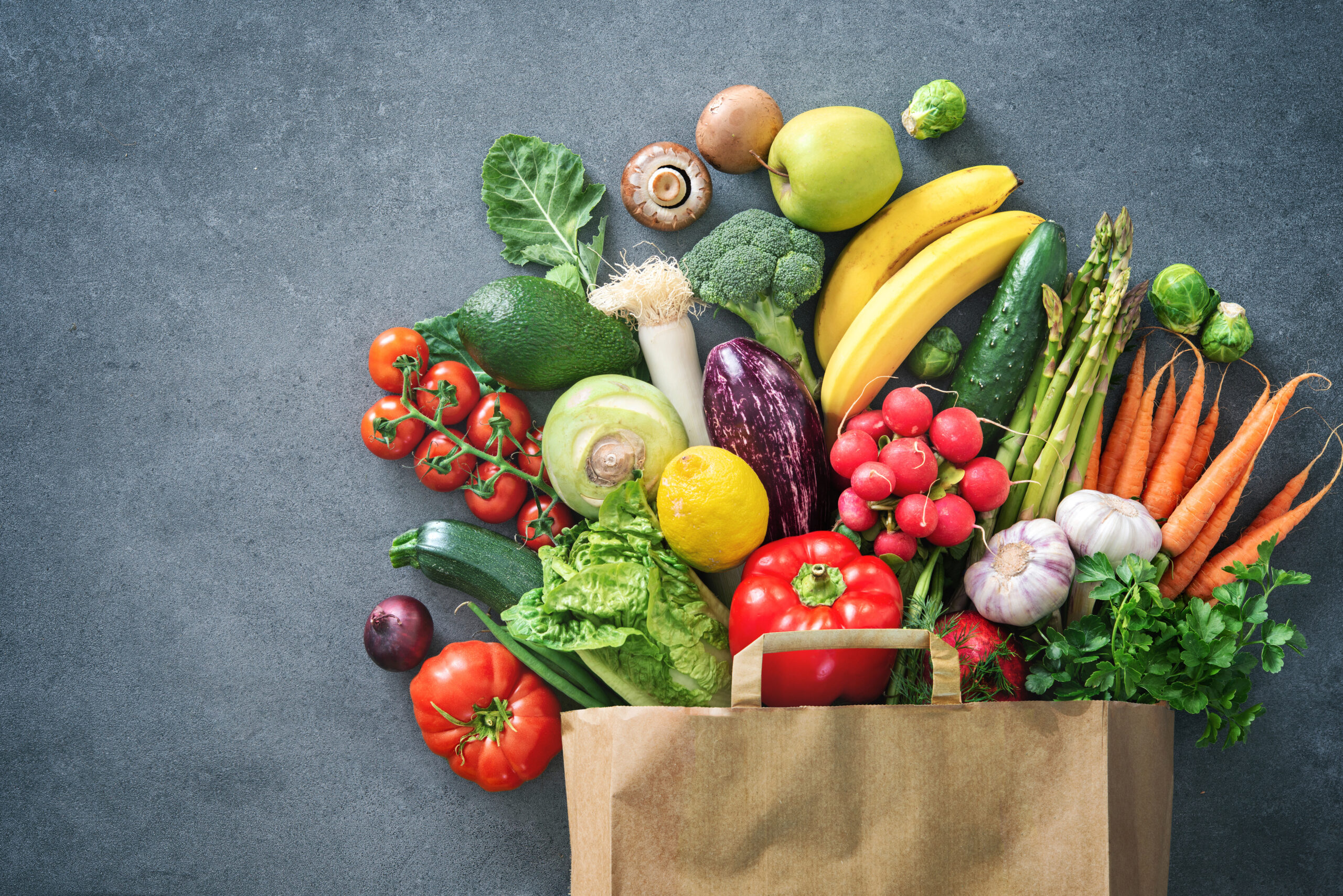 Shopping bag full of fresh vegetables and fruits