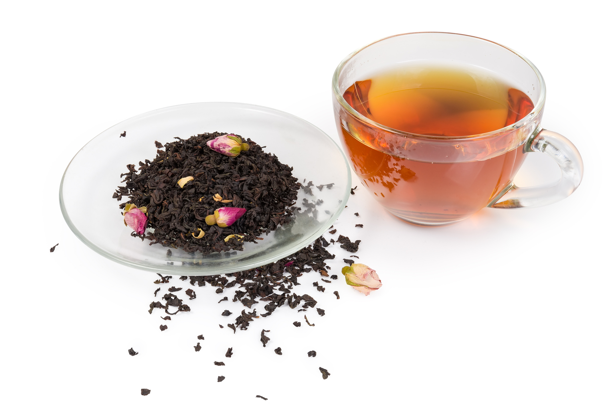 Cup of black tea, tea leaves with Chinese rose buds