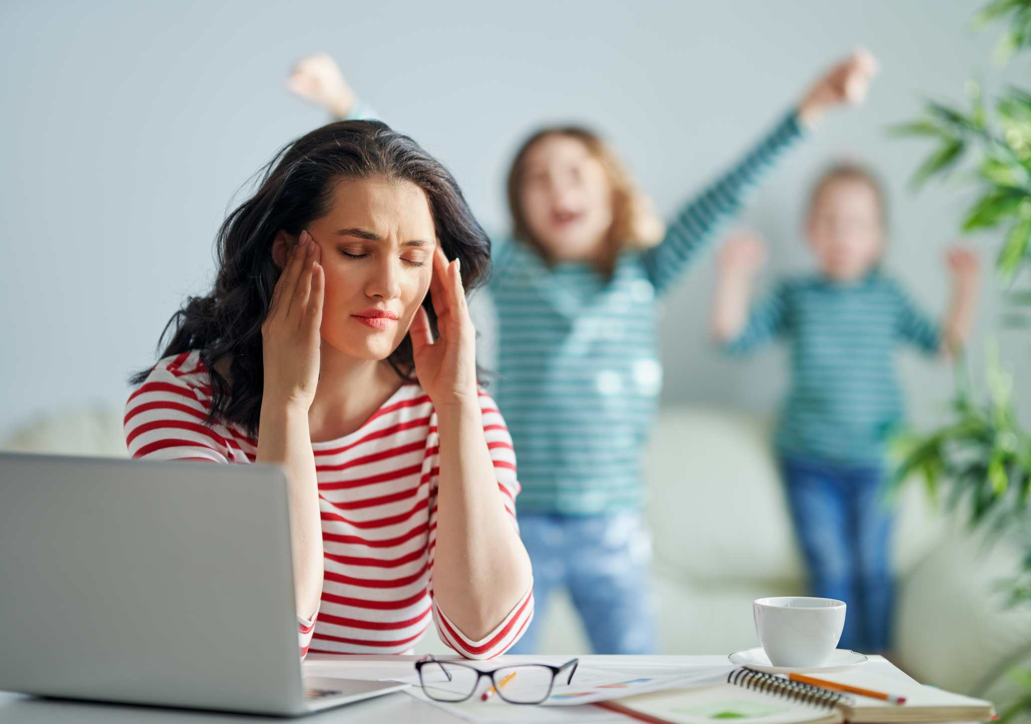 mother with children working on computer