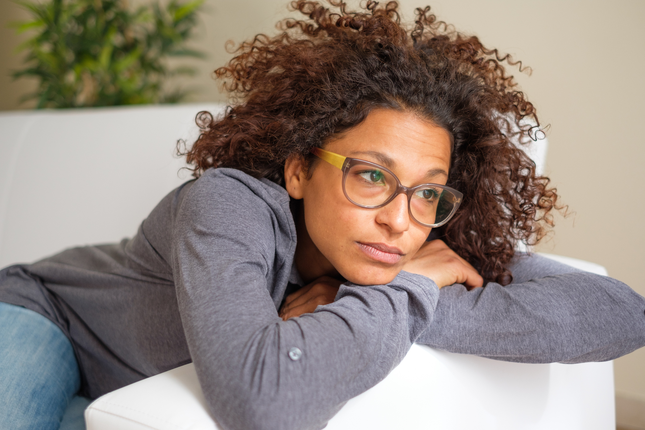 Worried black woman at home alone