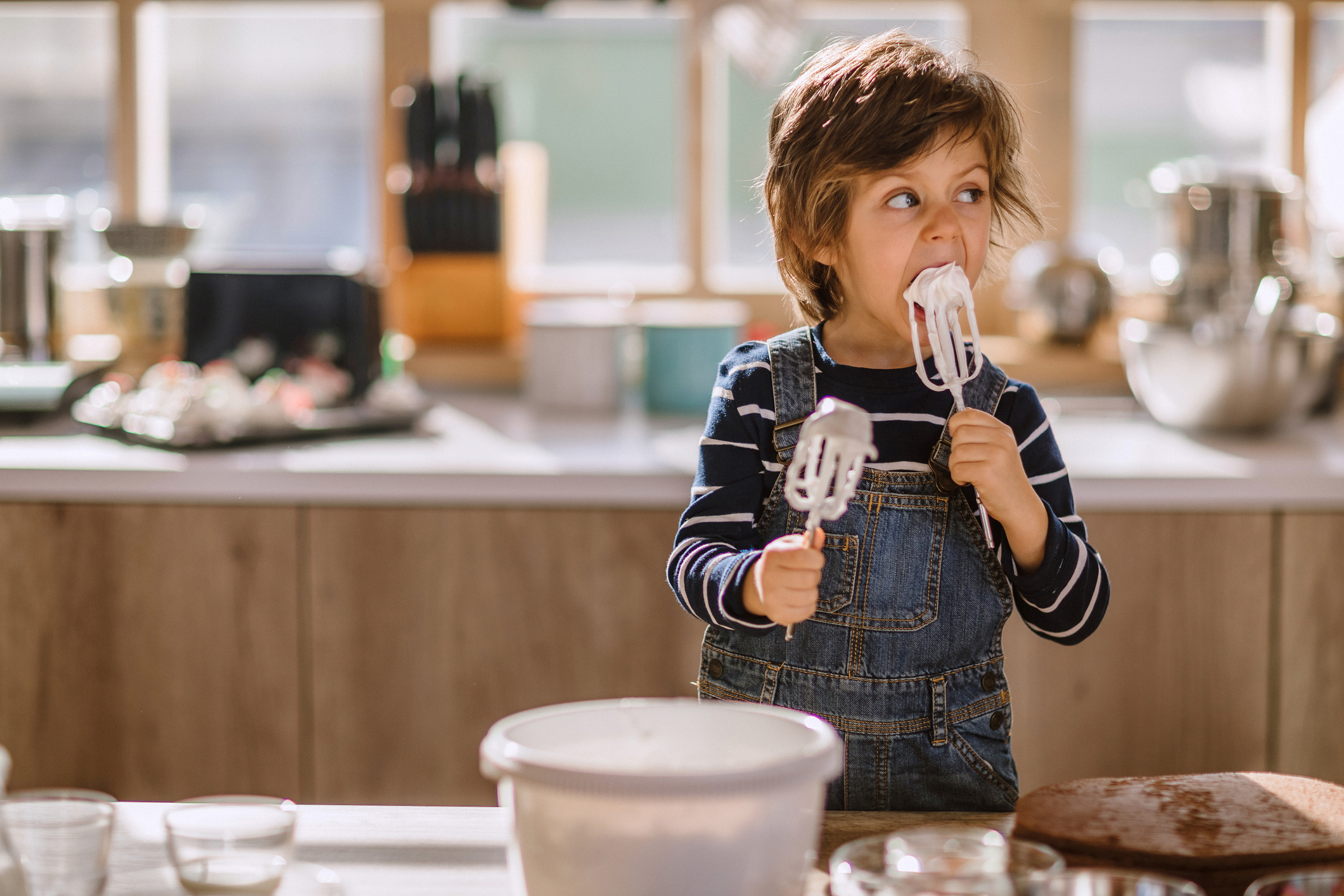 Cute Kid Tasting Whipped Cream of Egg Beater