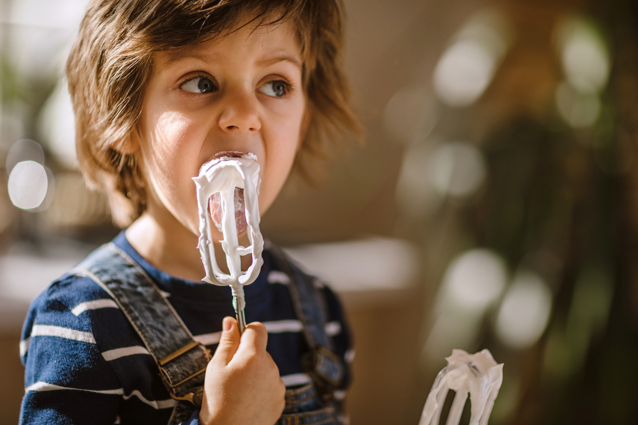 Cute Kid Tasting Whipped Cream of Egg Beater