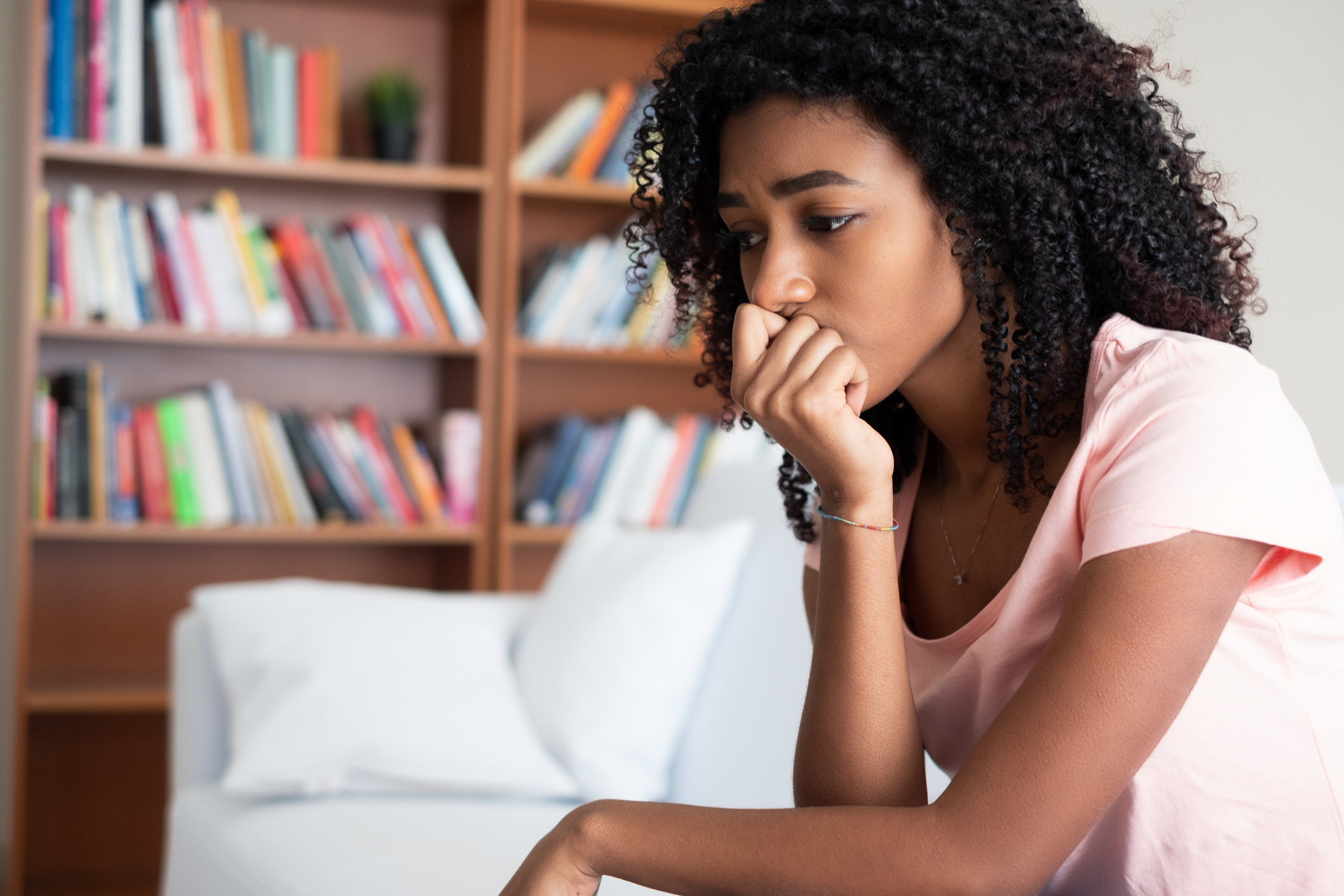 Young girl feeling alone and solitude at home