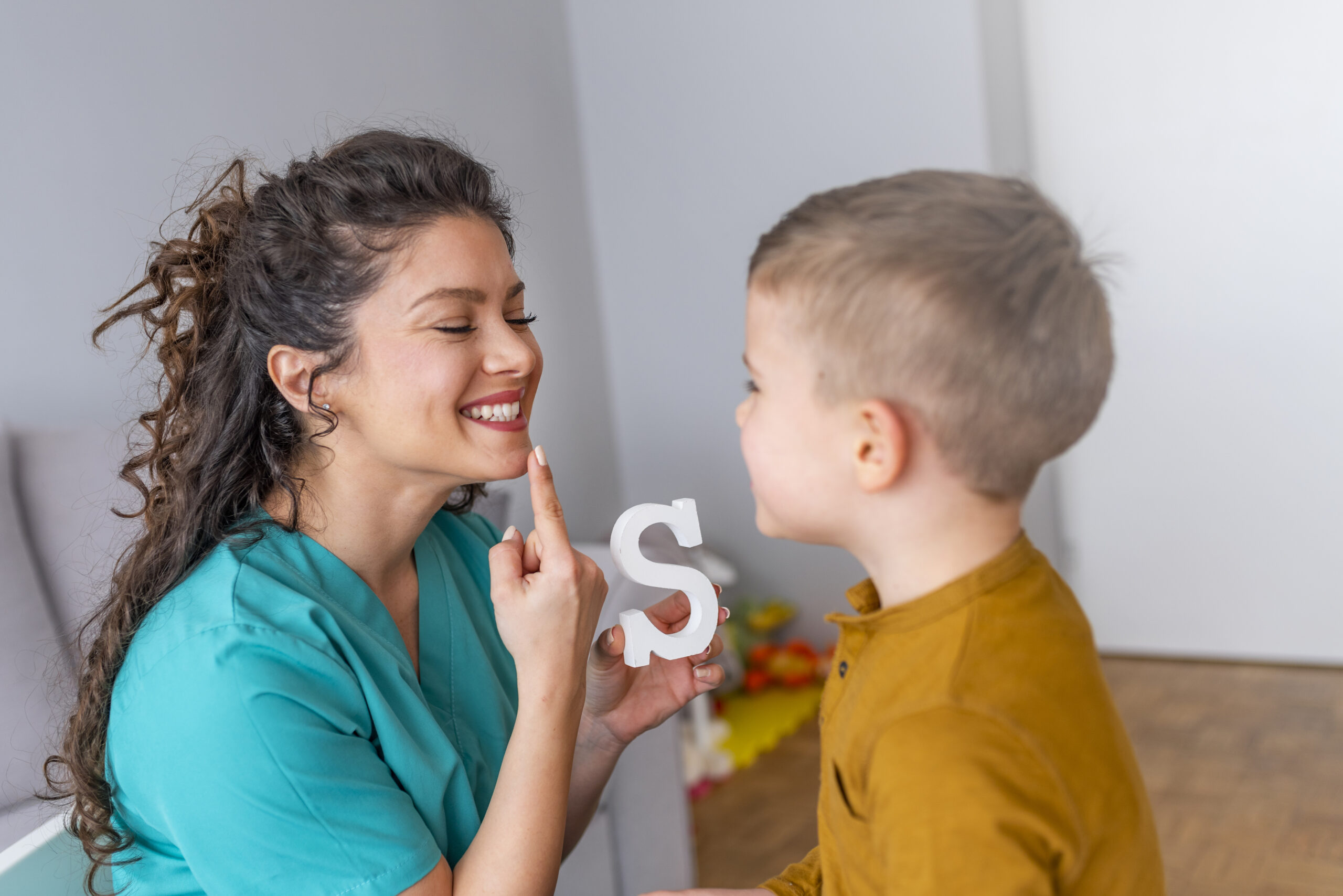 Shot of a speech therapist during a session with a little boy