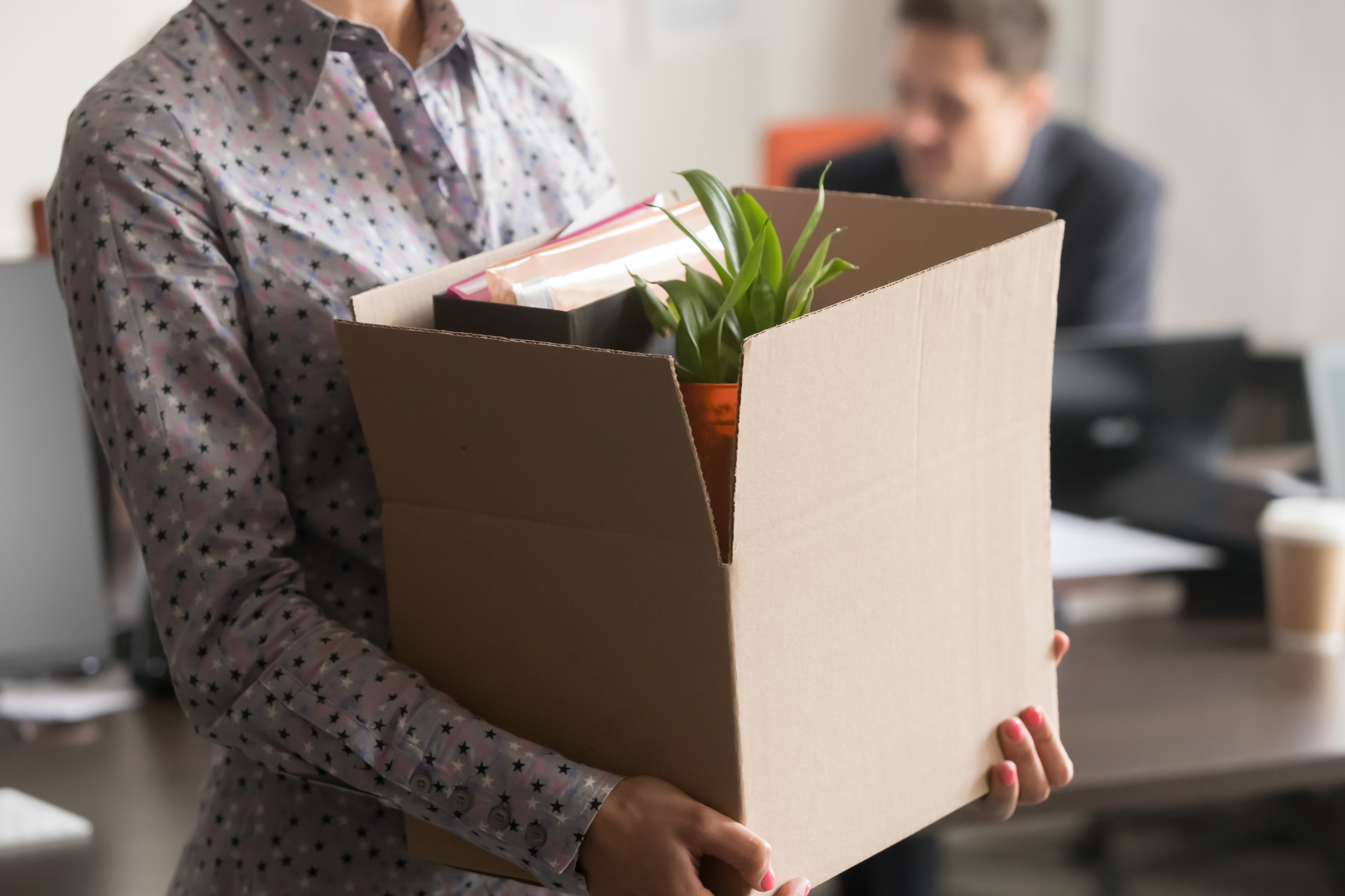 Close up view of new female employee intern holding box