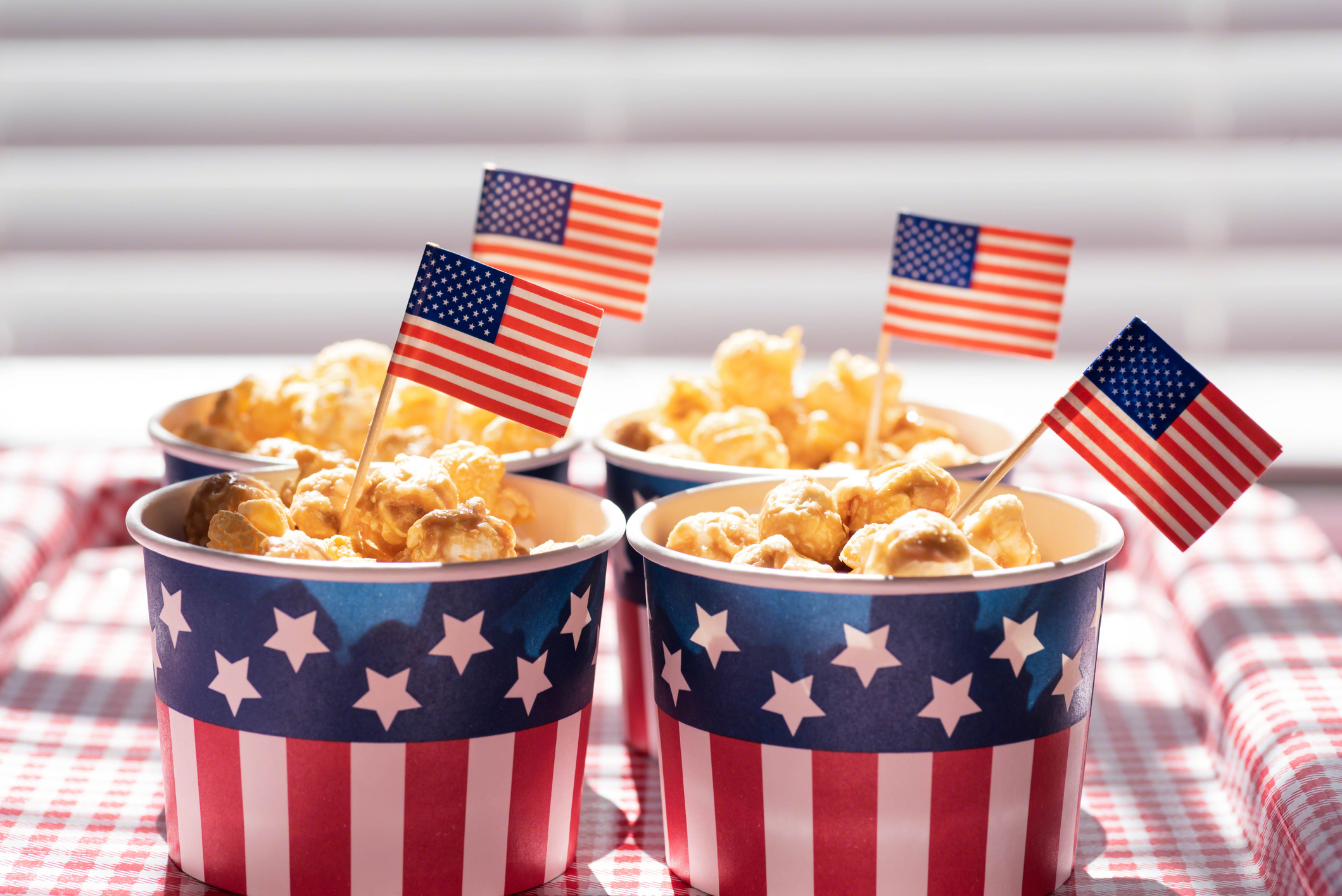 Caramel corn in patriotic snack cups for 4th of July party