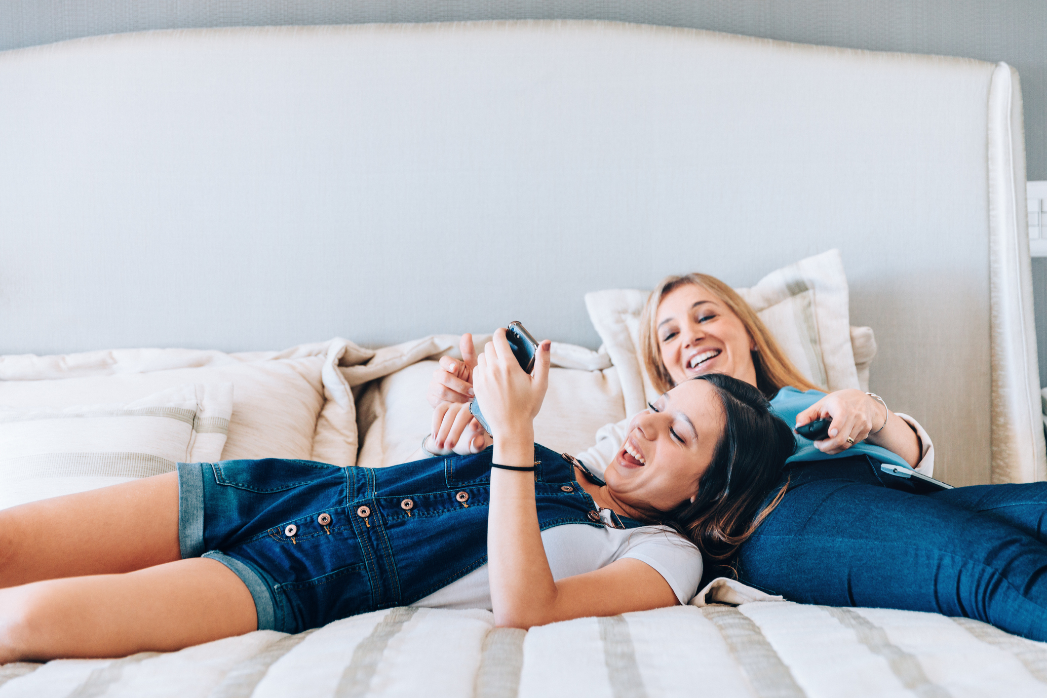 Mother and daughter enjoying time together on the bed