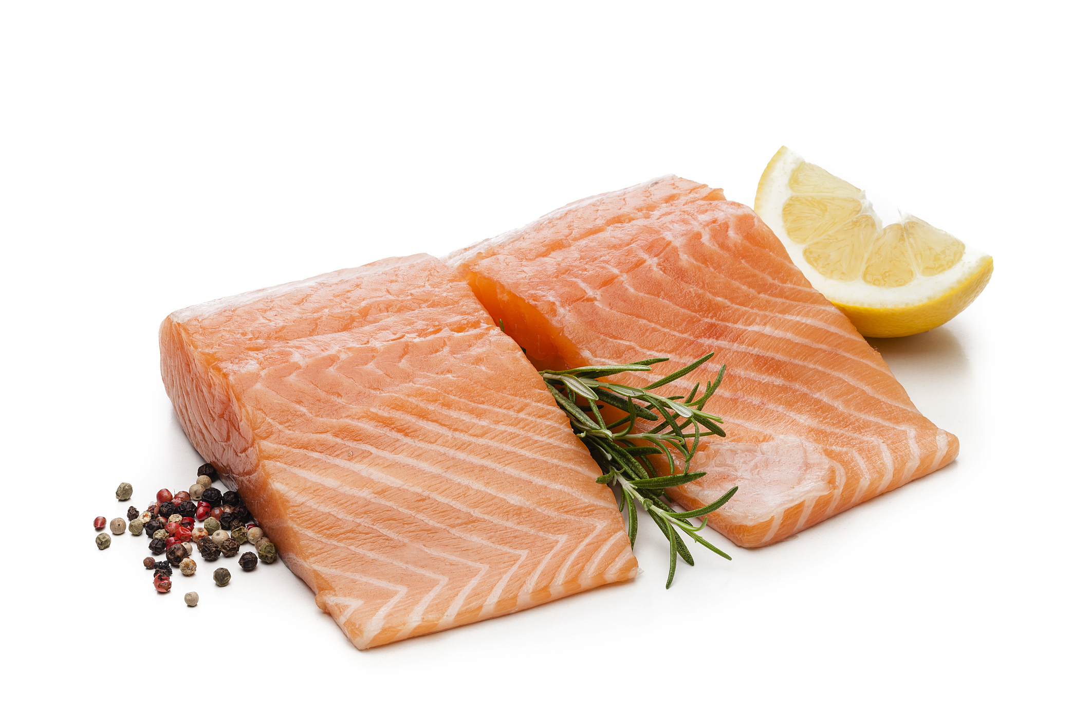 Two raw salmon fillets isolated on white background